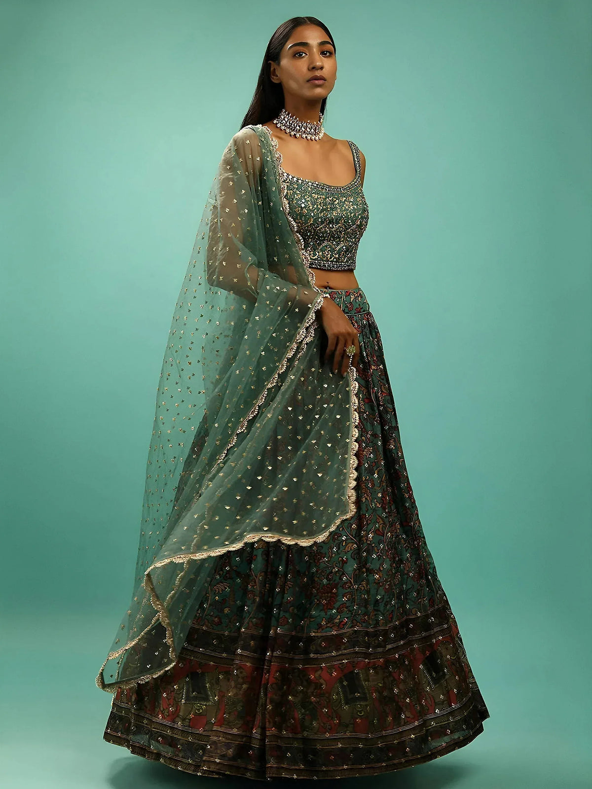 Elegant green embroidered lehenga choli with sheer dupatta, perfect for Indian ethnic wear