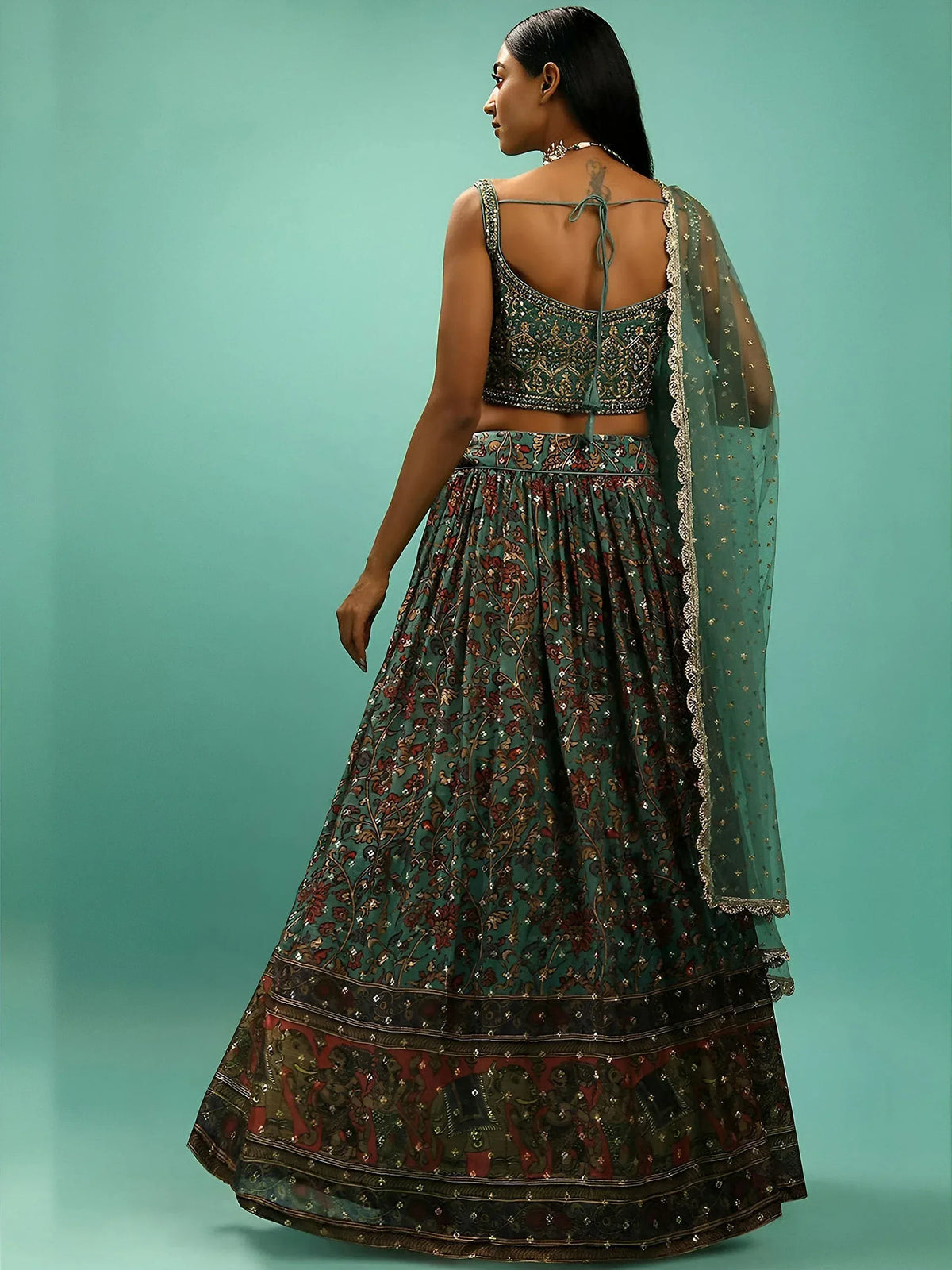 Elegant teal lehenga choli with floral embroidery and sheer dupatta for Indian ethnic wear