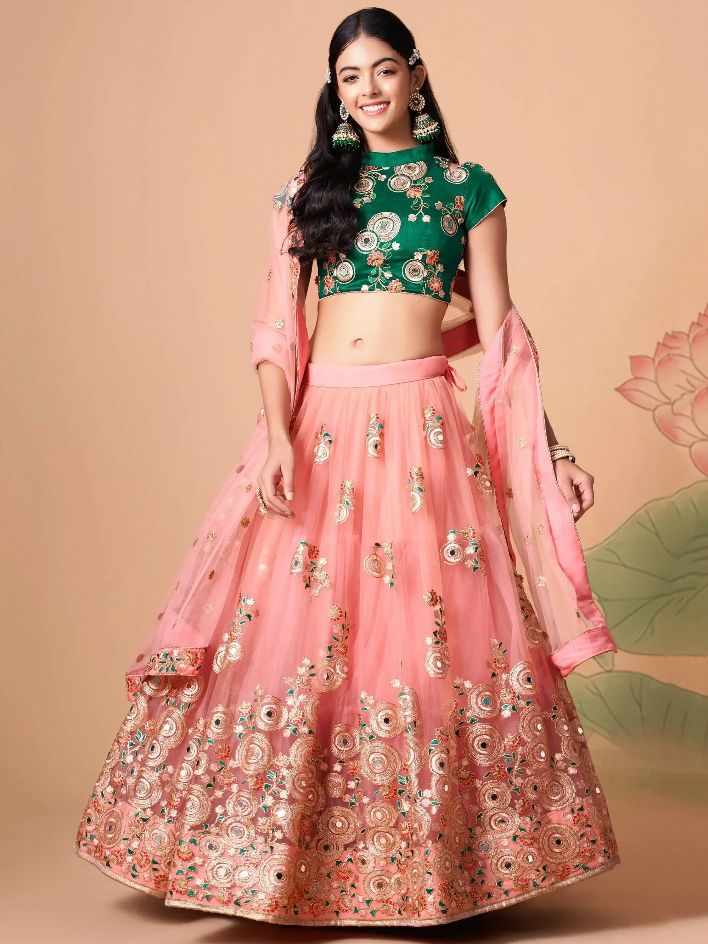 Pink and green embroidered lehenga choli with floral designs and gold detailing
