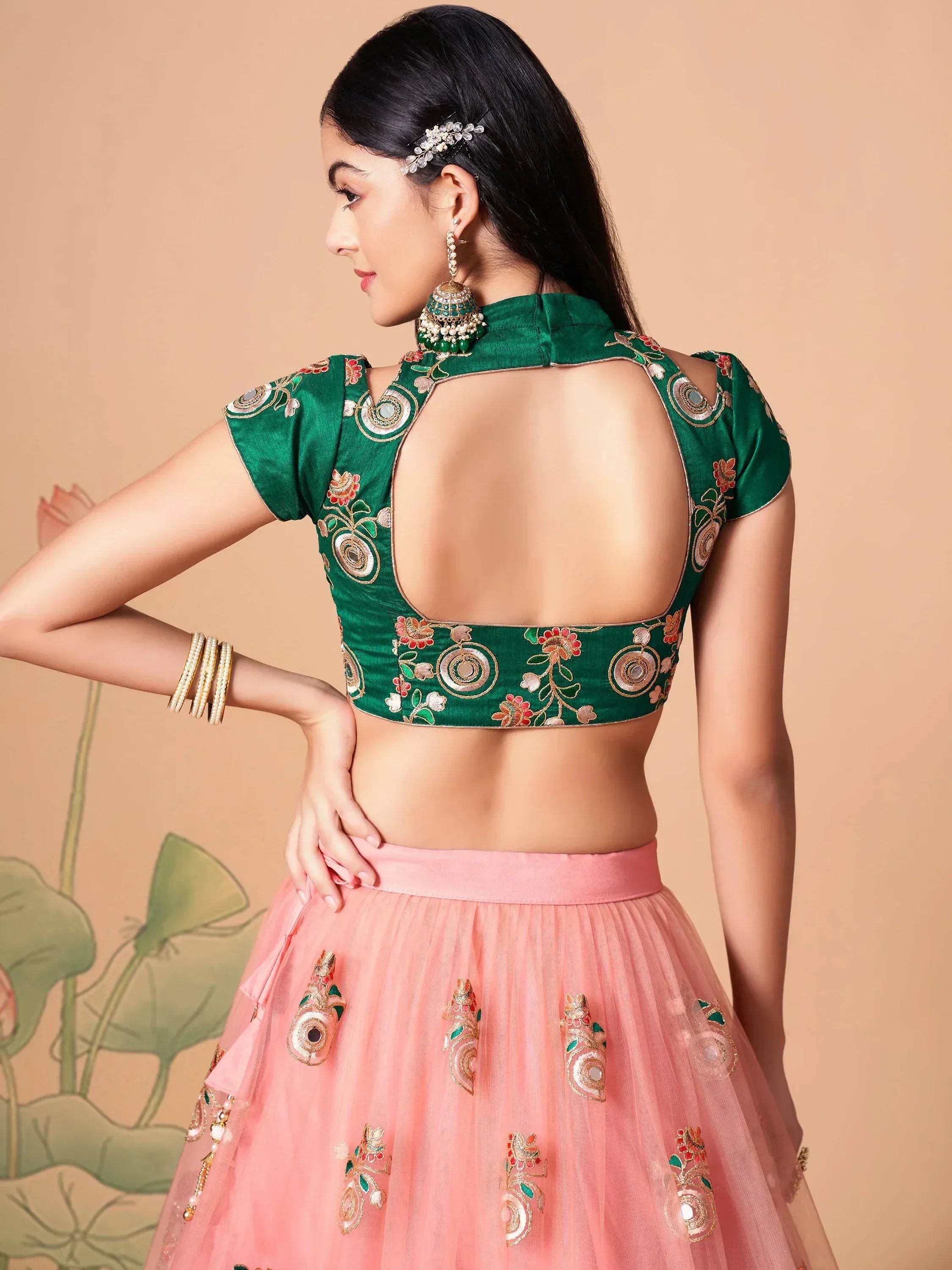 Green embroidered blouse with open back paired with pink lehenga skirt, Indian ethnic wear