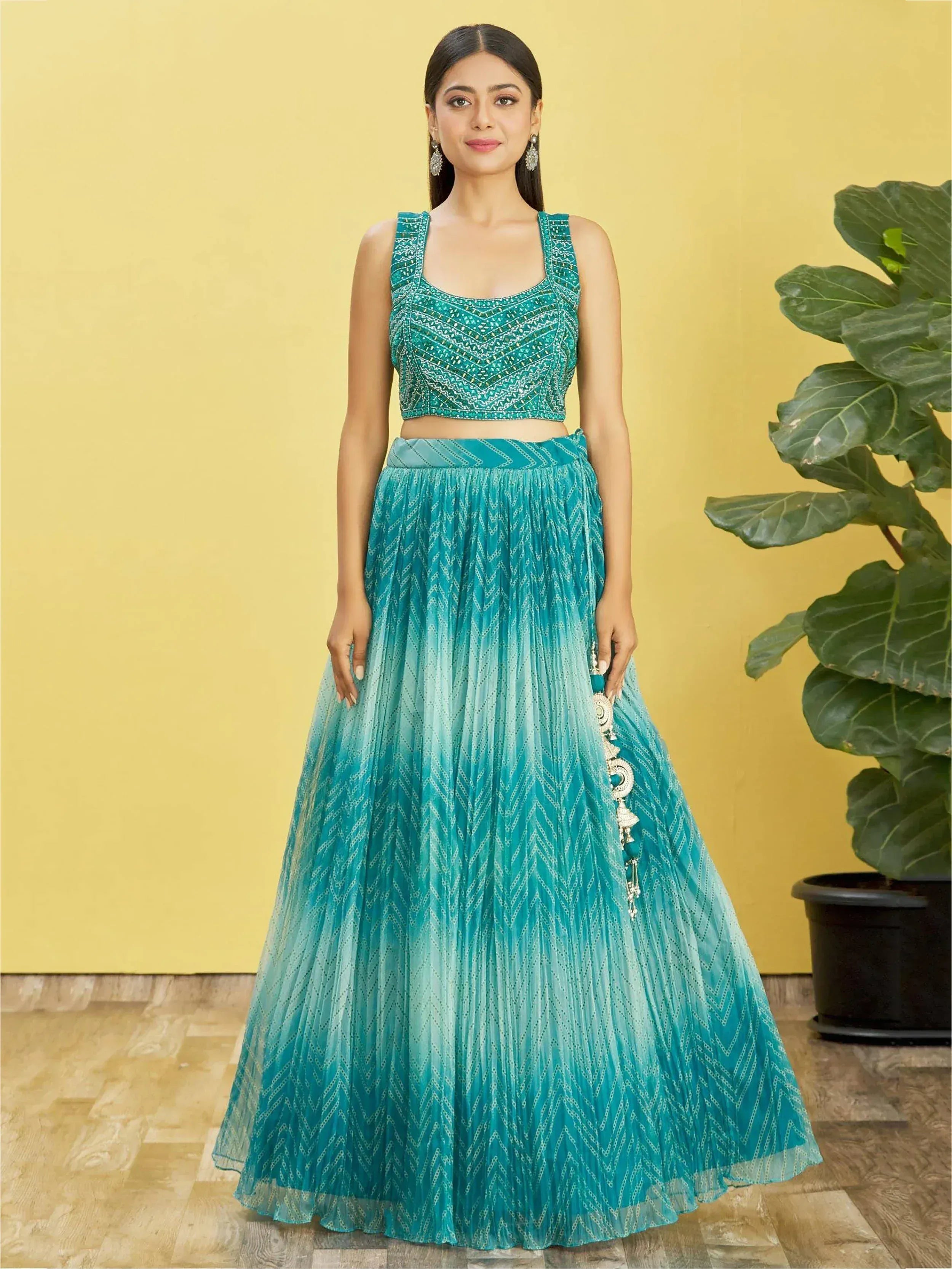 Teal embroidered lehenga choli with ombre pleated skirt, perfect for Indian ethnic wear occasions