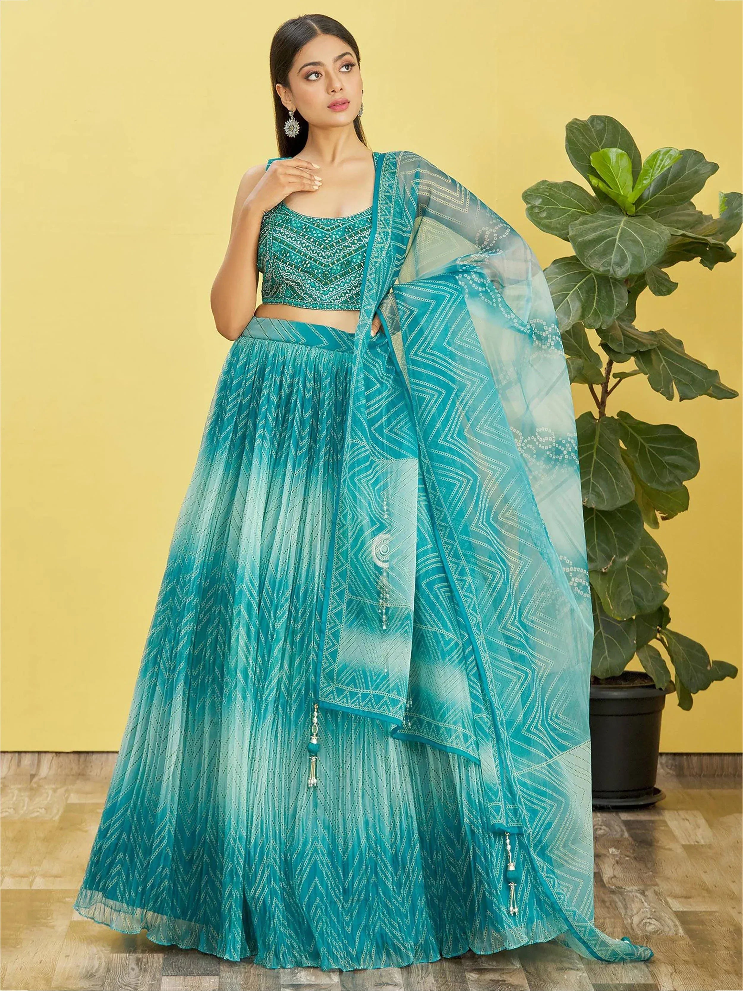 Teal blue designer lehenga choli with geometric print and sheer dupatta, ethnic Indian wear