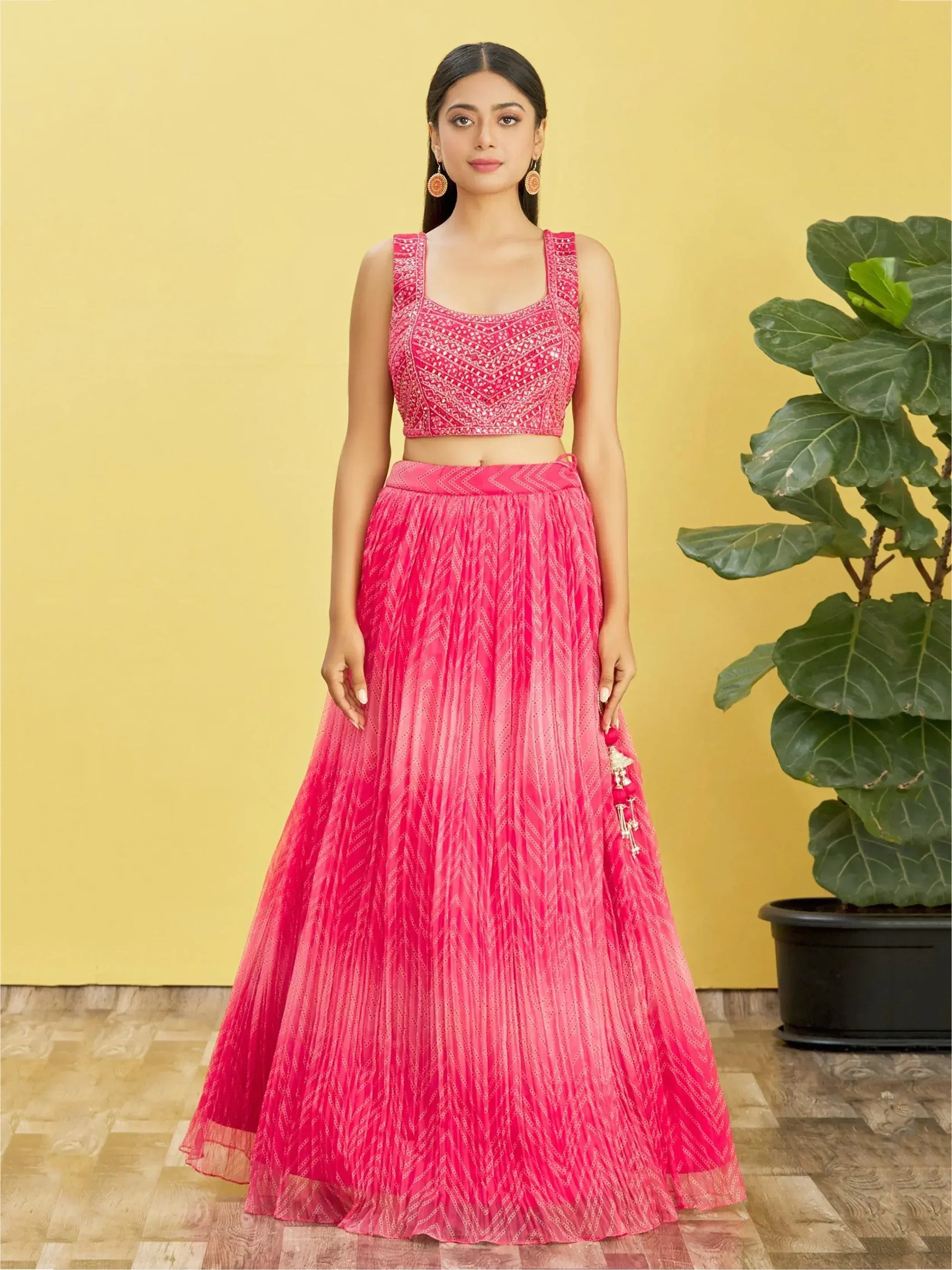Pink embroidered lehenga choli with pleated skirt, perfect for Indian ethnic wear occasions