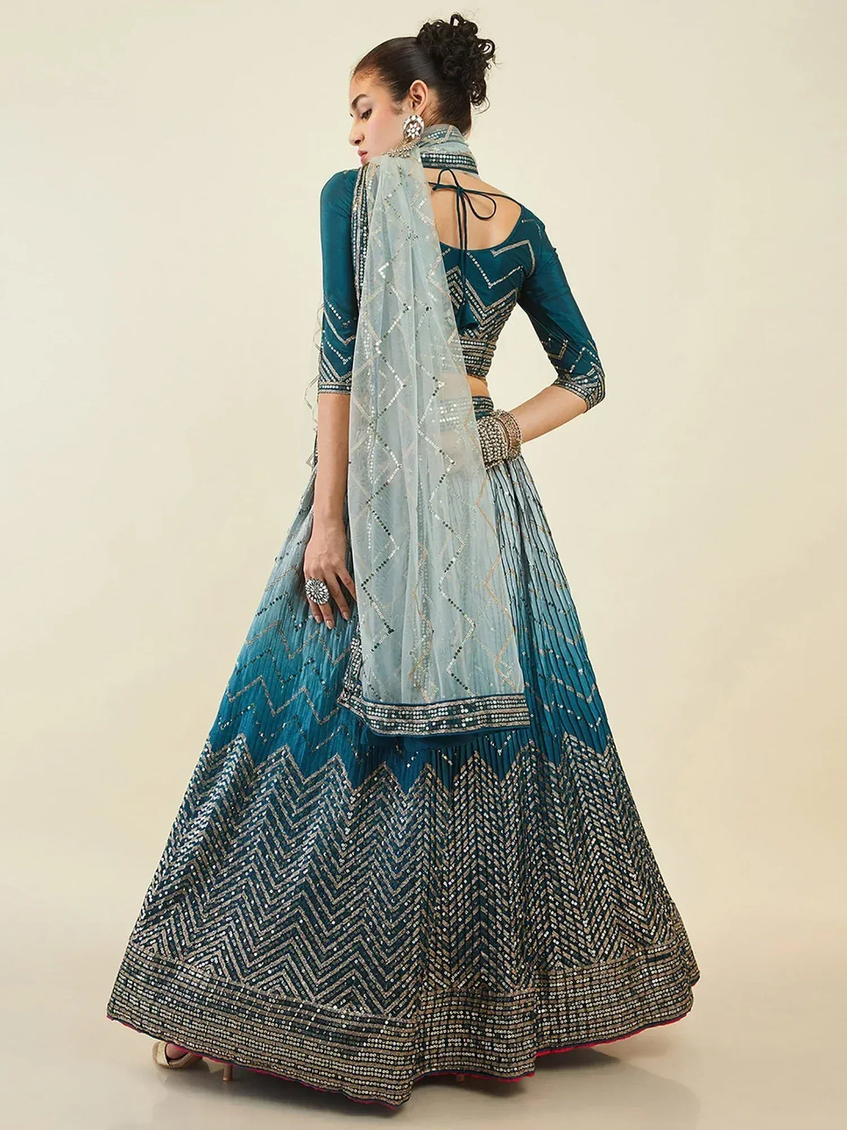 Teal designer lehenga choli with zigzag embroidery and sheer dupatta for Indian ethnic wear