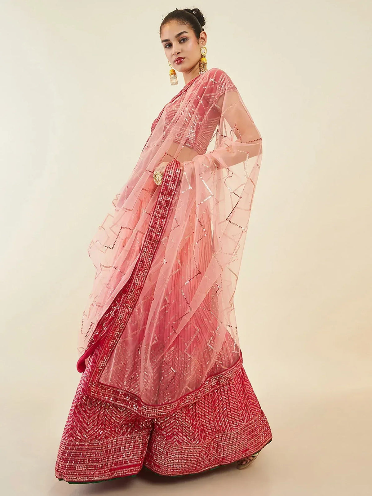 Pink designer lehenga choli with intricate embroidery and sheer dupatta for ethnic wear