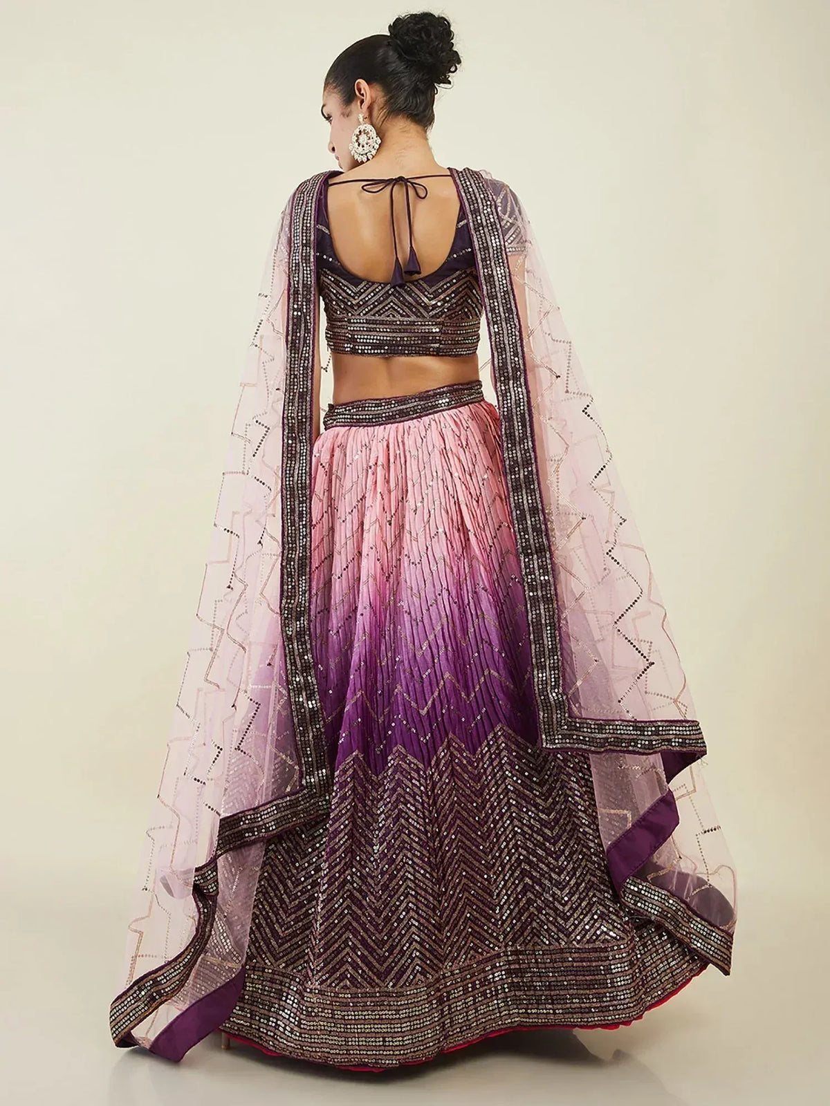 Purple ombre lehenga choli with sequin chevron pattern and sheer dupatta, back view