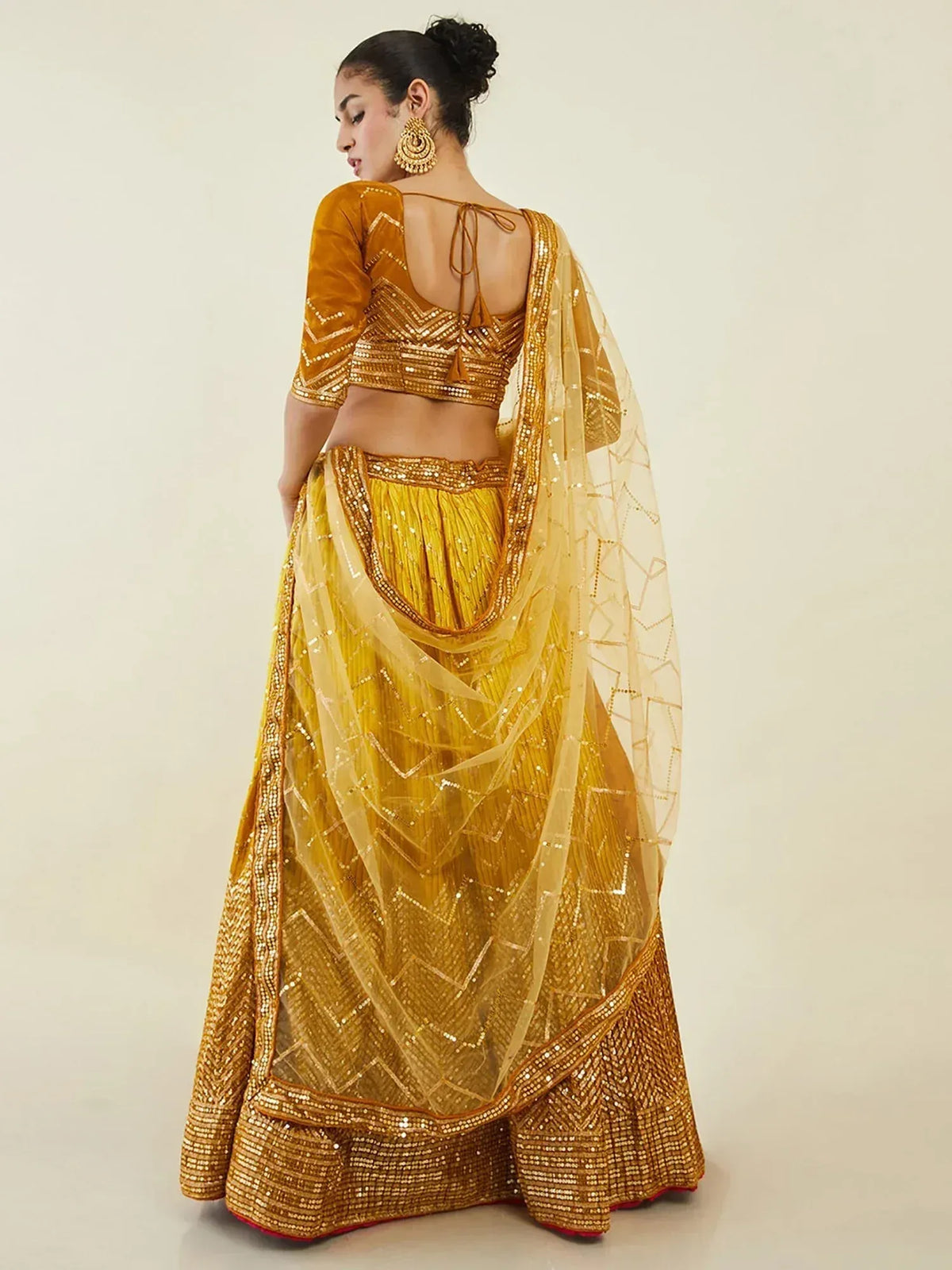 Golden sequin lehenga choli with sheer dupatta, ethnic Indian wear for weddings and festivals