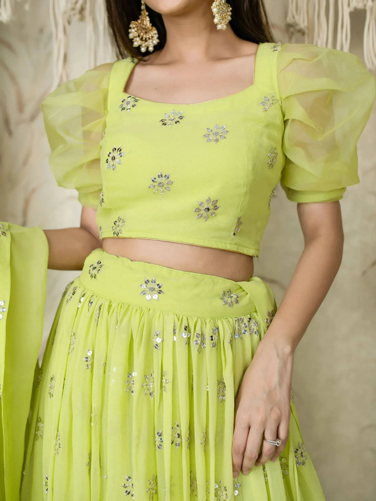 Lime green lehenga choli with floral mirror work and puff sleeves, perfect for Indian ethnic wear