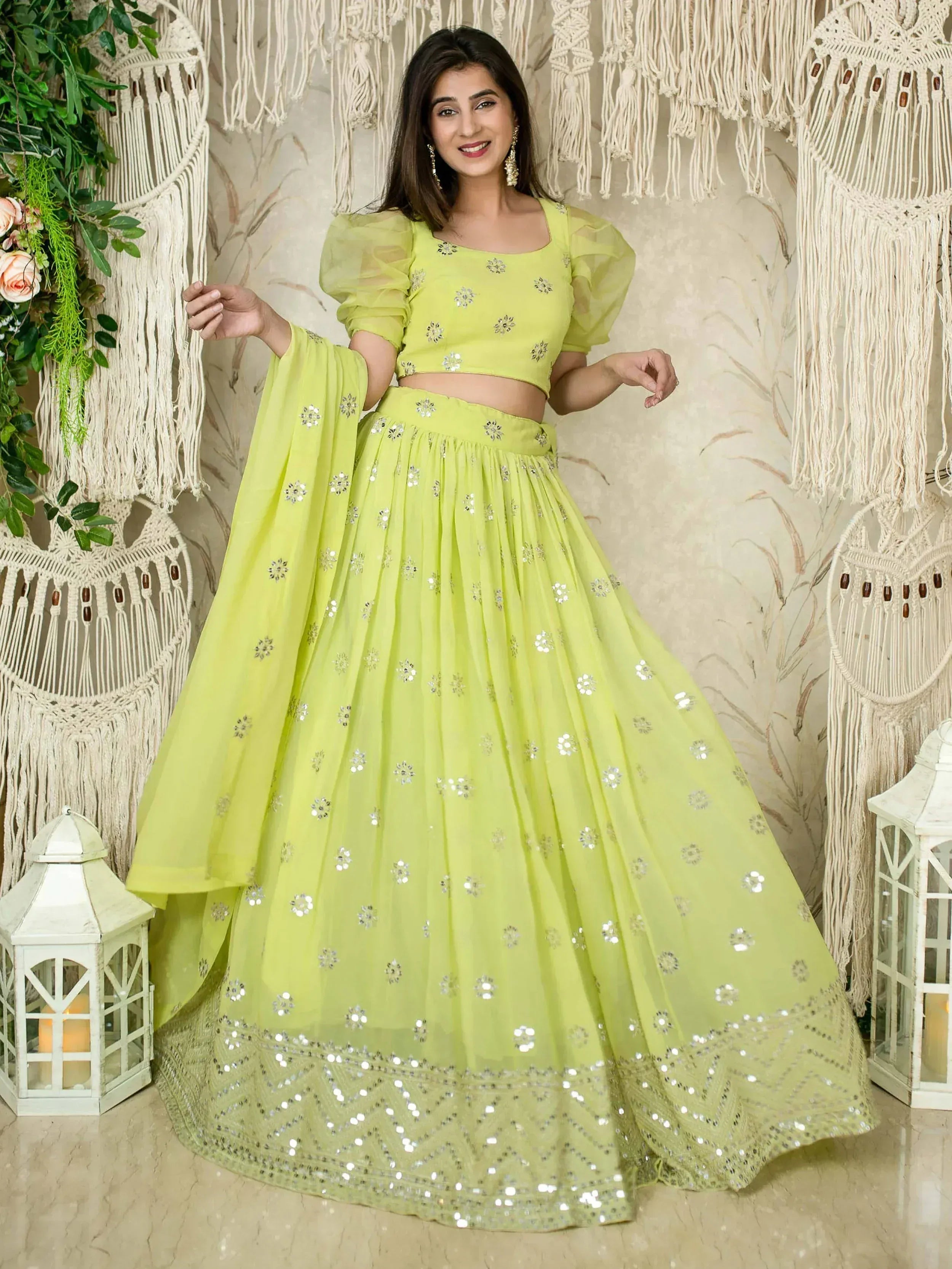 Lime green lehenga choli with silver mirror work and puff sleeves, perfect for Indian ethnic wear events.