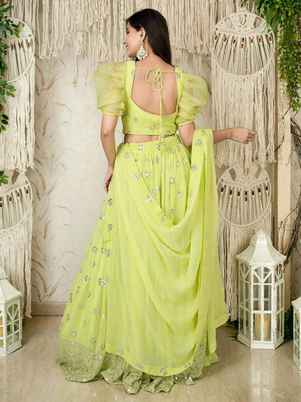 Lime green designer lehenga choli with puff sleeves, floral embroidery, and back tie detail for festive occasions