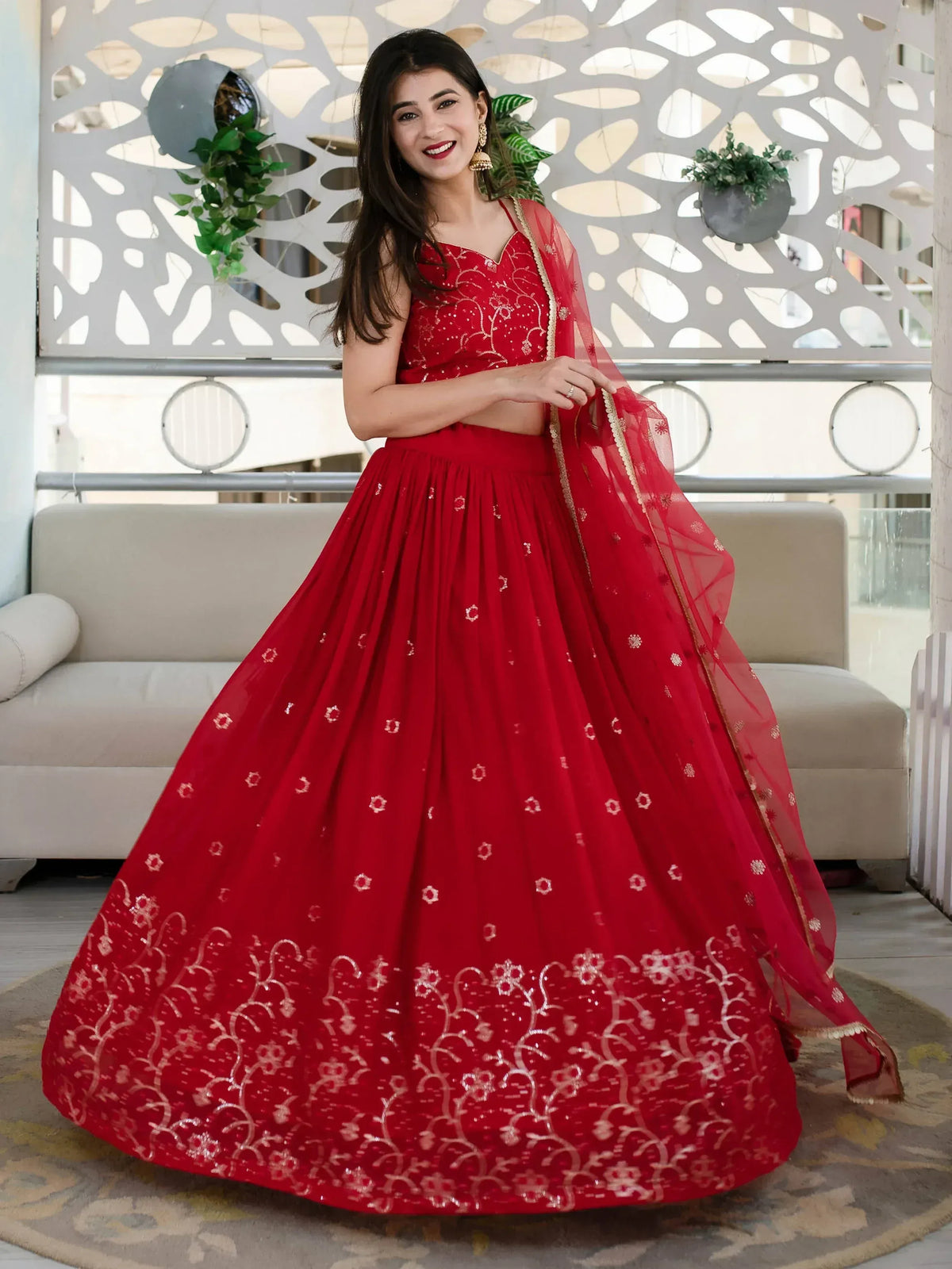Red embroidered lehenga choli with gold detailing, perfect for Indian ethnic wear and festive occasions.