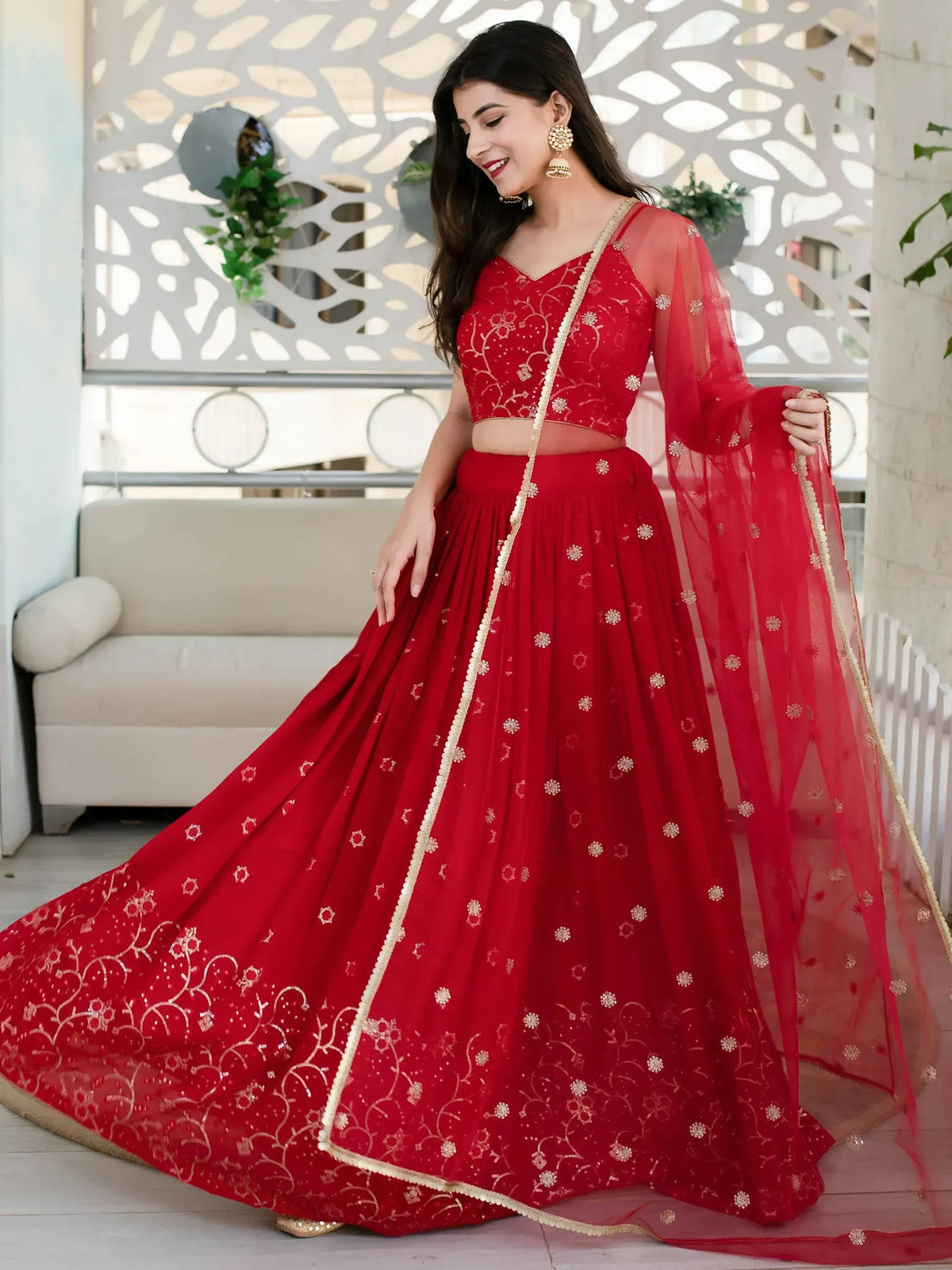 Red embroidered lehenga choli with gold detailing, perfect for Indian ethnic wear and festive occasions.