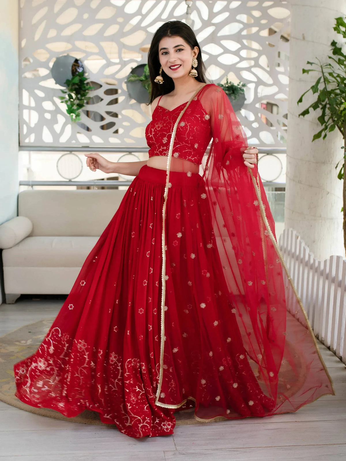 Red embroidered lehenga choli with sheer dupatta, perfect for Indian weddings and festive occasions