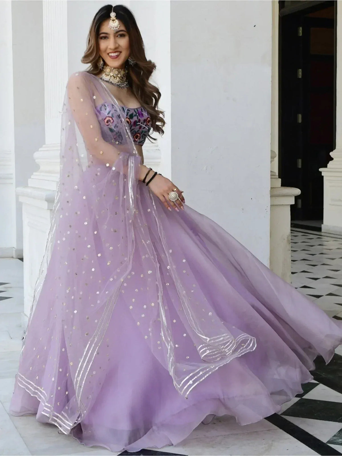 Lavender designer lehenga choli with floral embroidery and sequin work, perfect for Indian ethnic wear events.