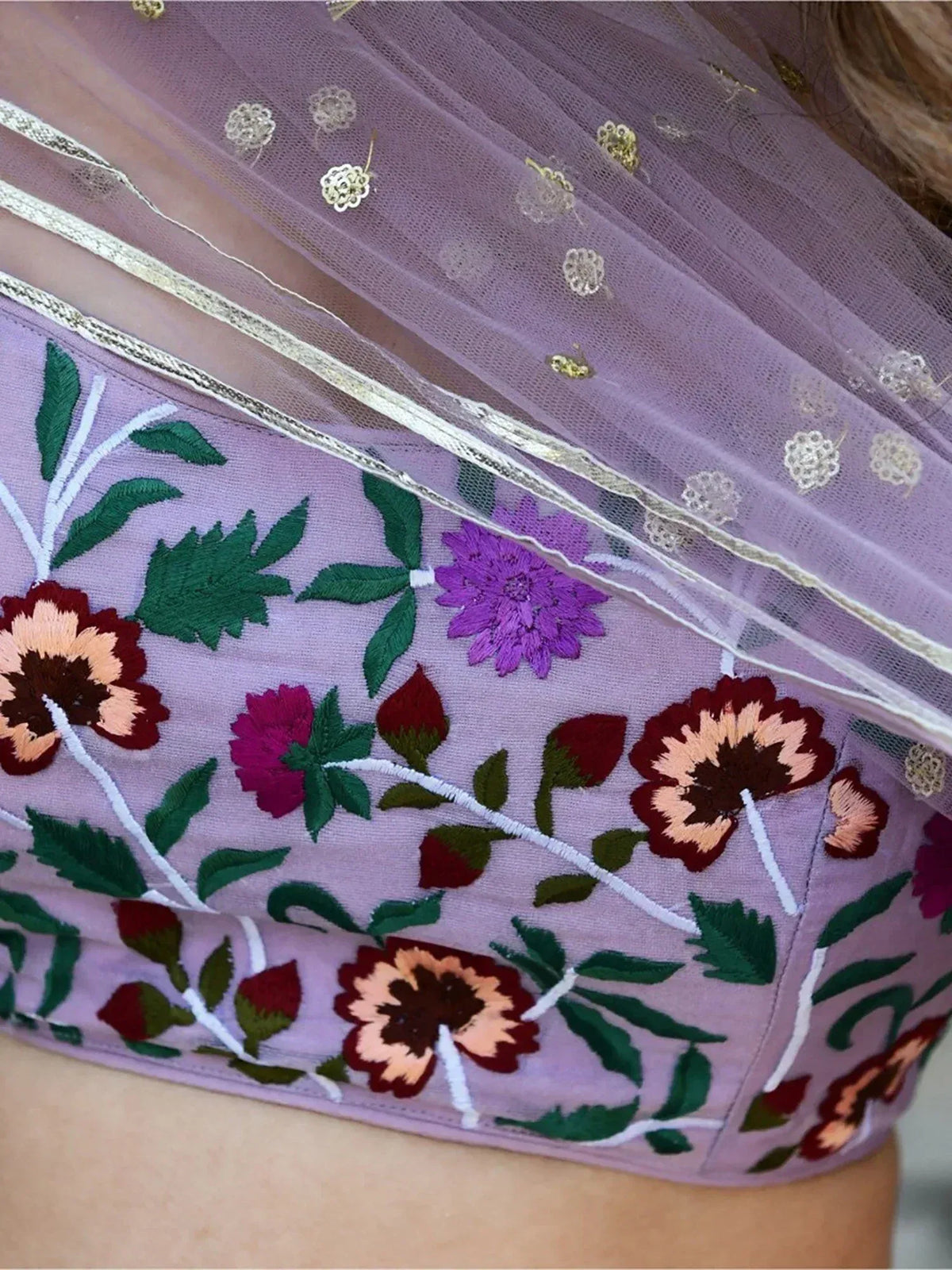 Lavender embroidered lehenga choli with floral motifs and sheer overlay