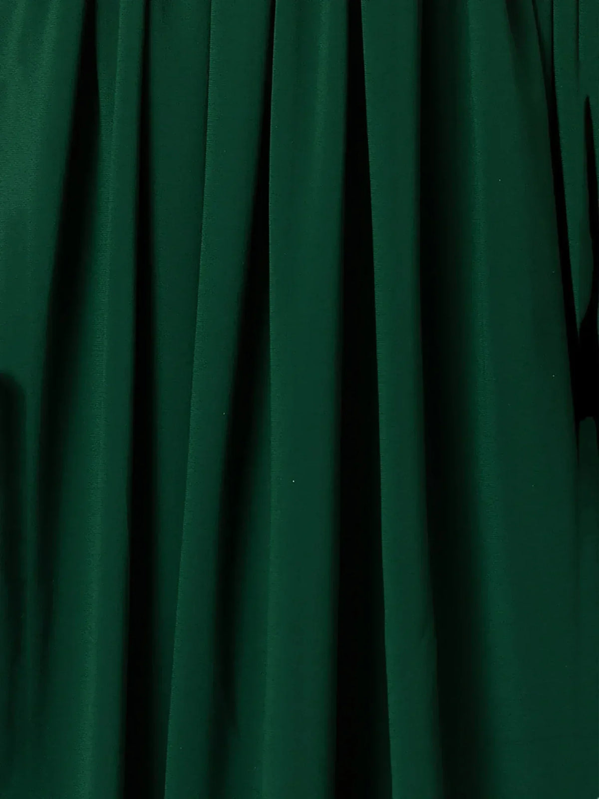 Rich emerald green pleated fabric for ethnic wear, perfect for lehenga choli or saree designs.