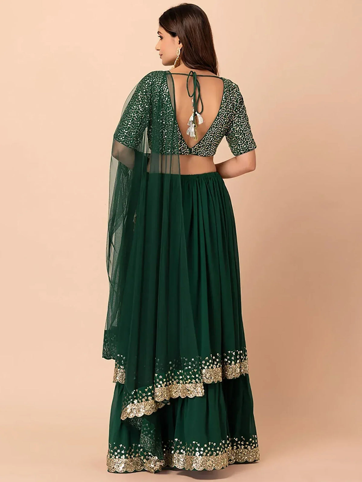Emerald green lehenga choli with sequin work, sheer dupatta, and scalloped gold border for Indian ethnic wear