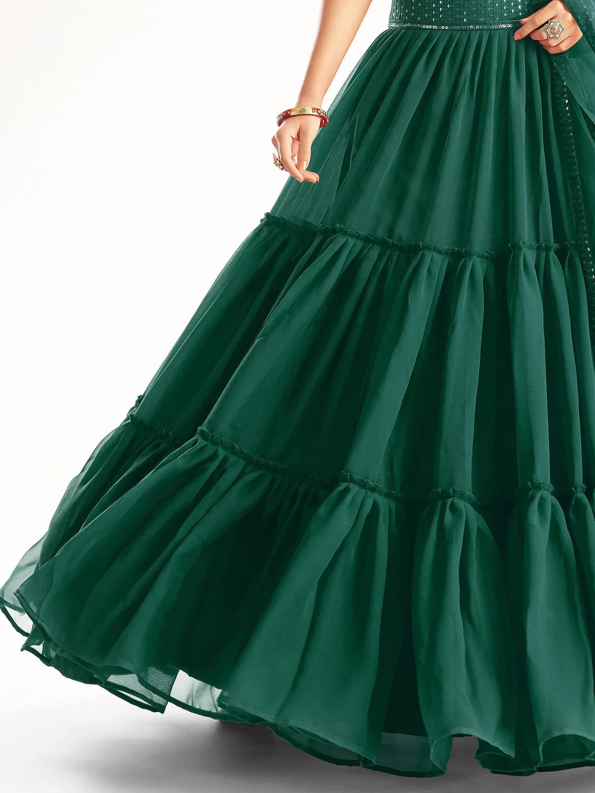 Emerald green tiered lehenga skirt with pleats and sequin waistband, perfect for Indian ethnic wear