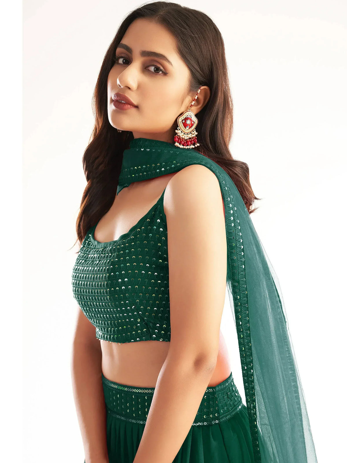 Emerald green sequin lehenga choli with matching dupatta, perfect for Indian ethnic wear occasions.