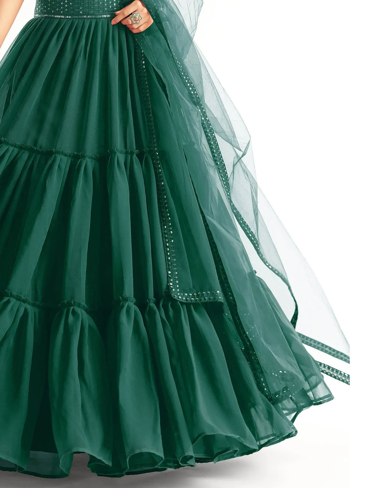 Emerald green tiered lehenga with sequin detailing and sheer dupatta, perfect for Indian ethnic wear occasions.