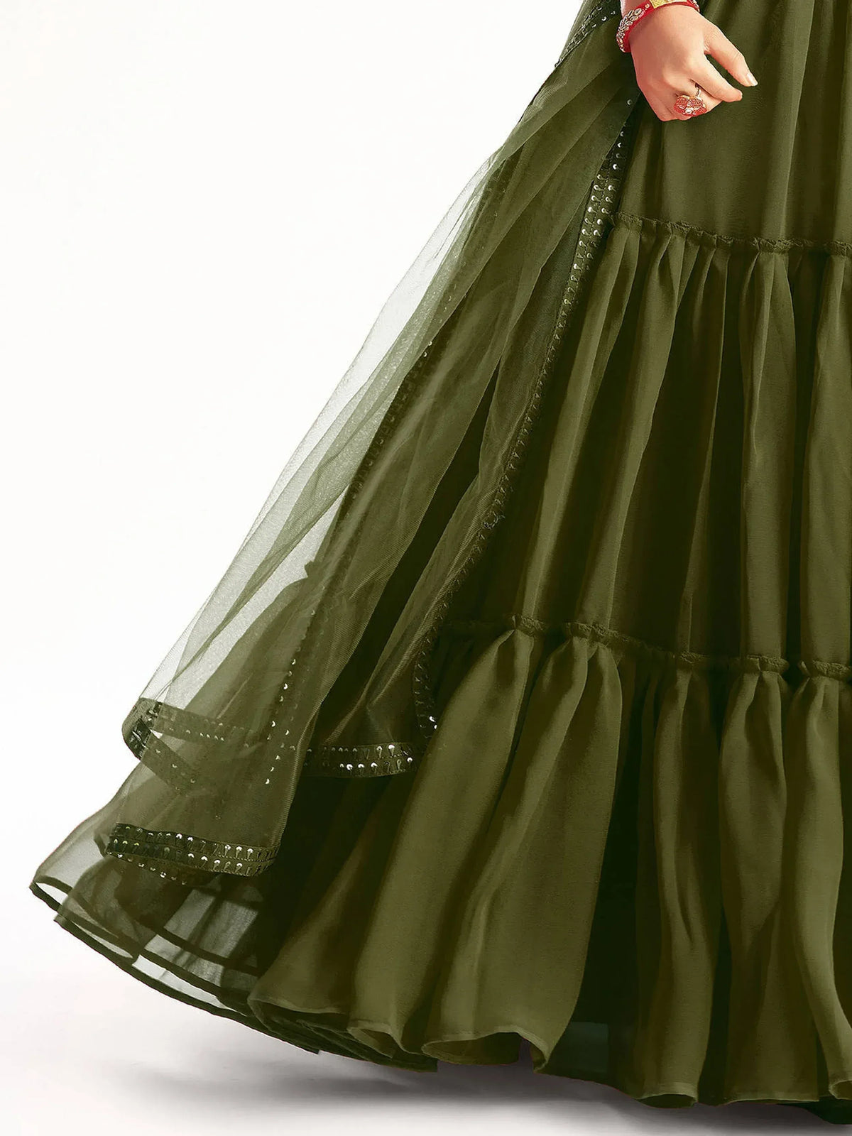 Olive green tiered ethnic gown with sheer overlay and embellished hem, perfect for festive occasions.