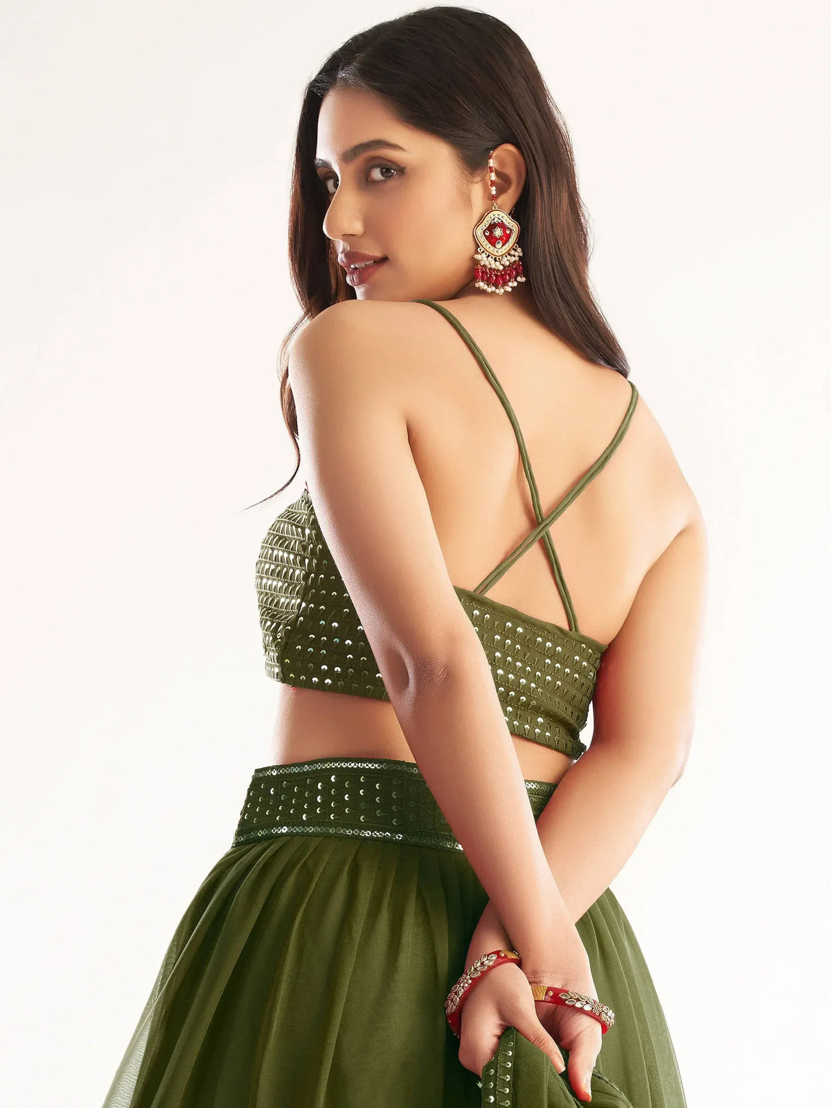 Olive green sequin lehenga choli with crisscross back, perfect for Indian ethnic wear events.