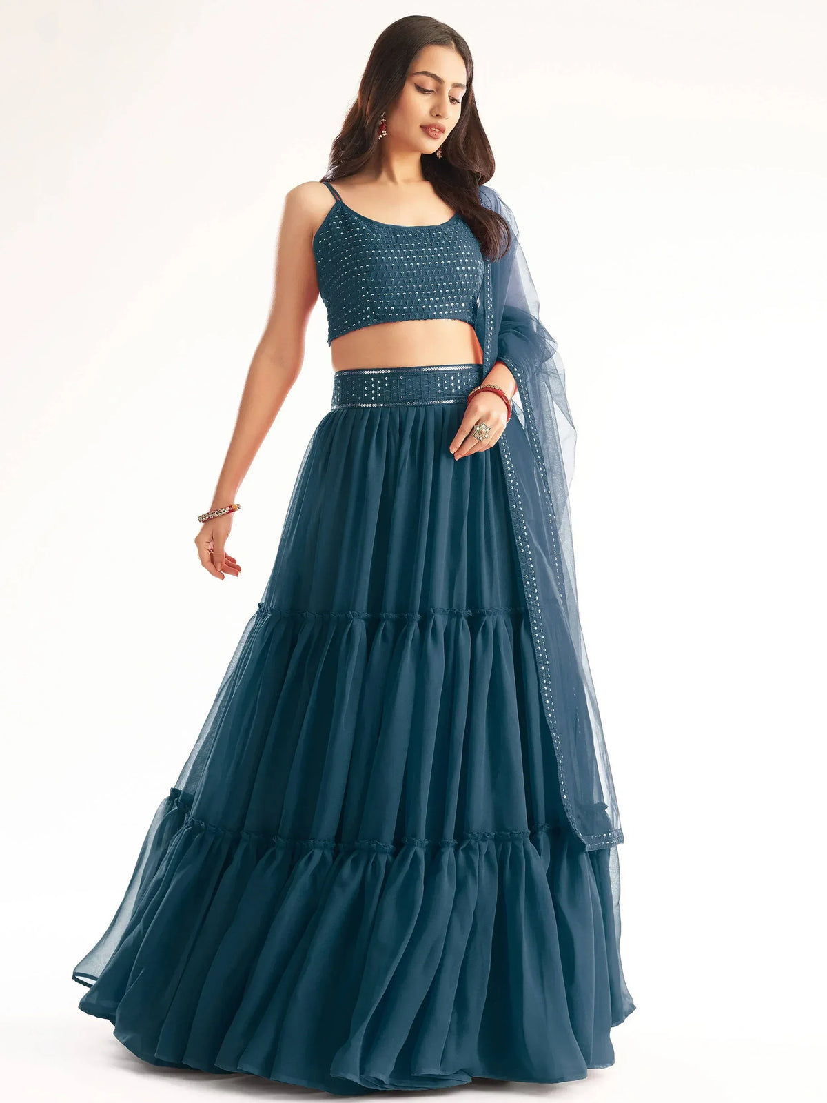 Teal blue sequined lehenga choli with layered skirt and sheer dupatta, Indian ethnic wear