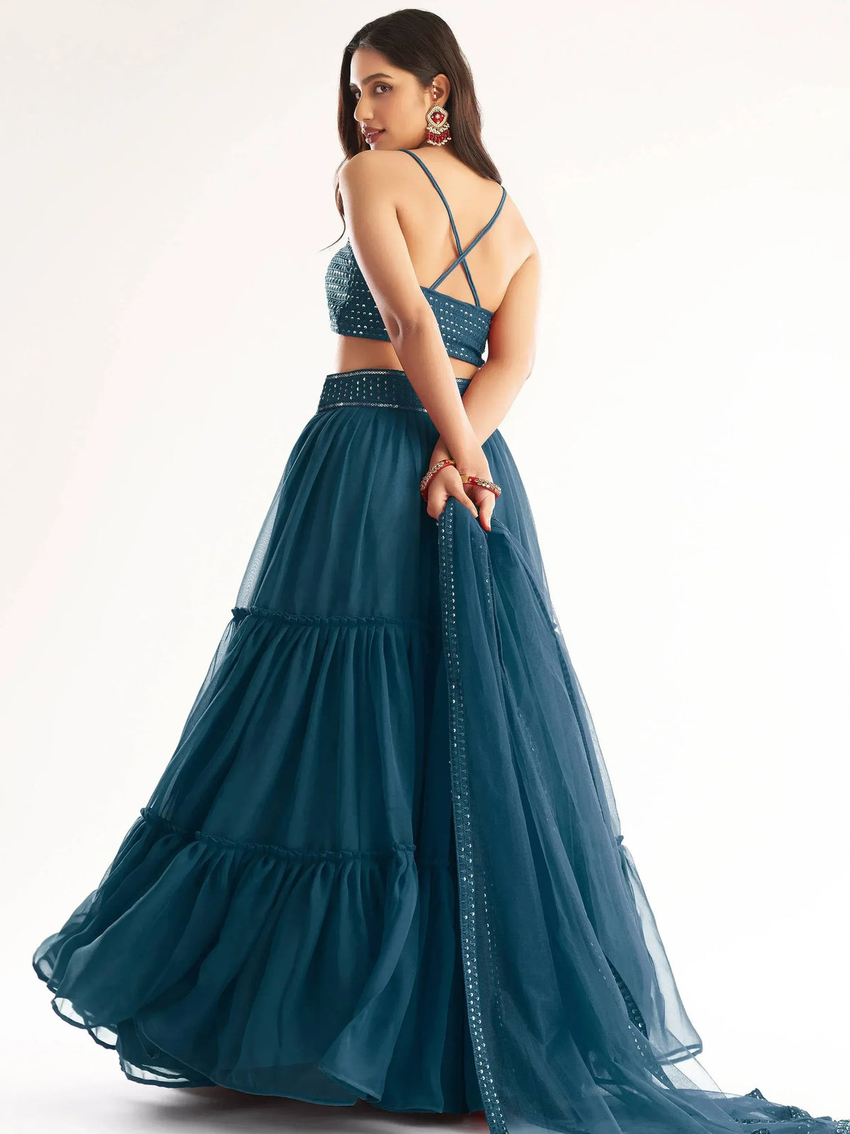 Teal blue designer lehenga choli with sequin embellishments and layered skirt, perfect for Indian ethnic wear