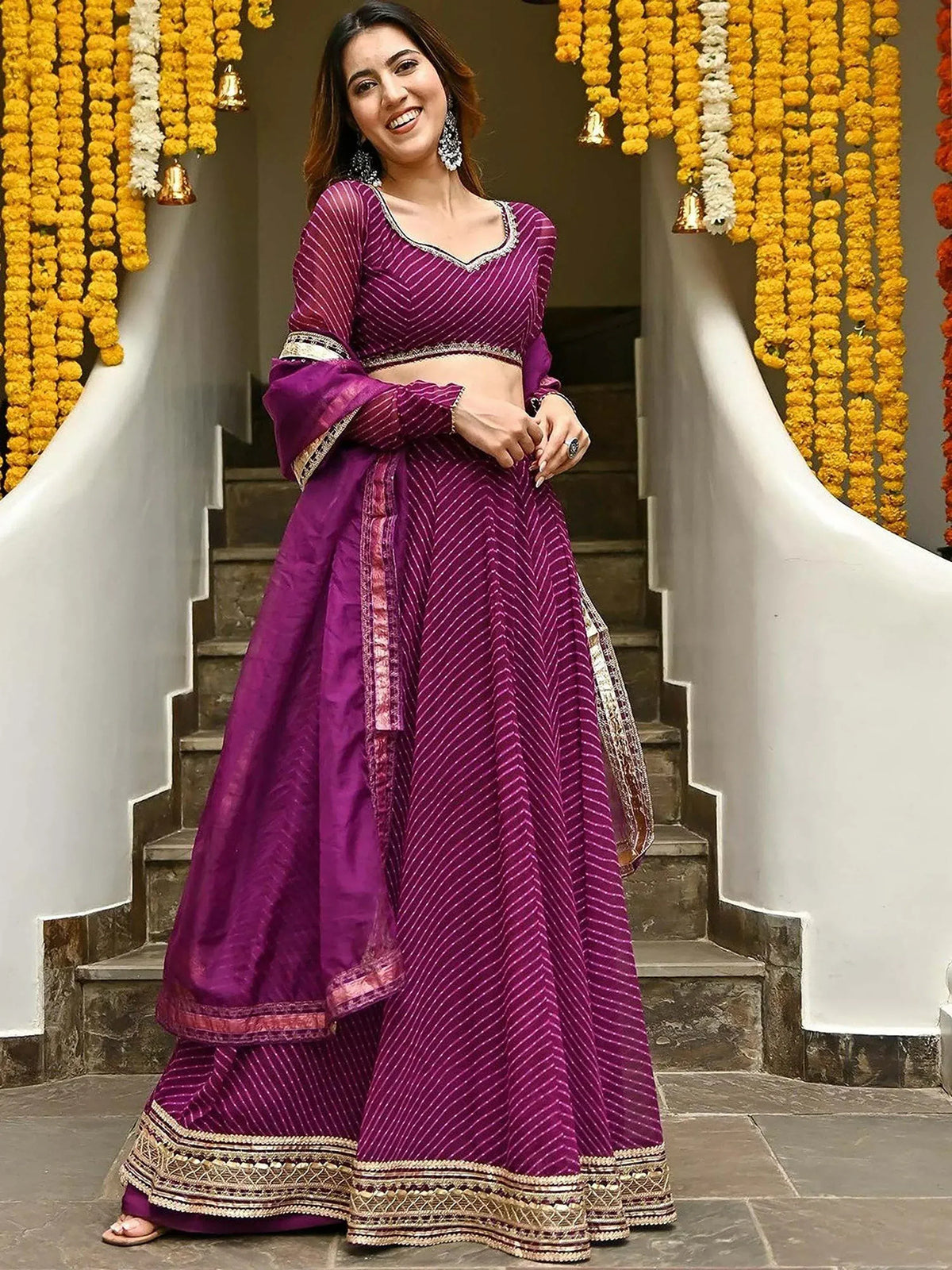Purple striped lehenga choli with gold border, perfect for Indian ethnic wear and festive occasions.