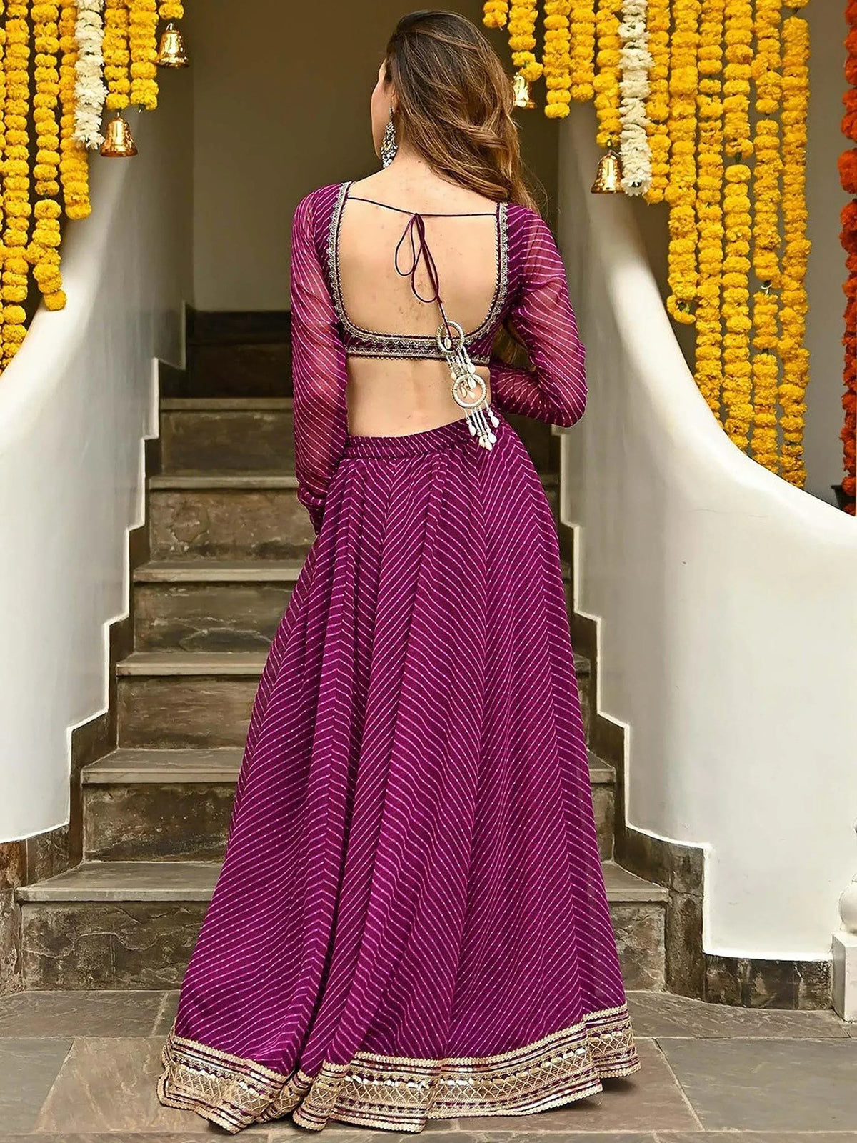 Purple striped lehenga choli with open back and gold embroidery, perfect for Indian ethnic wear