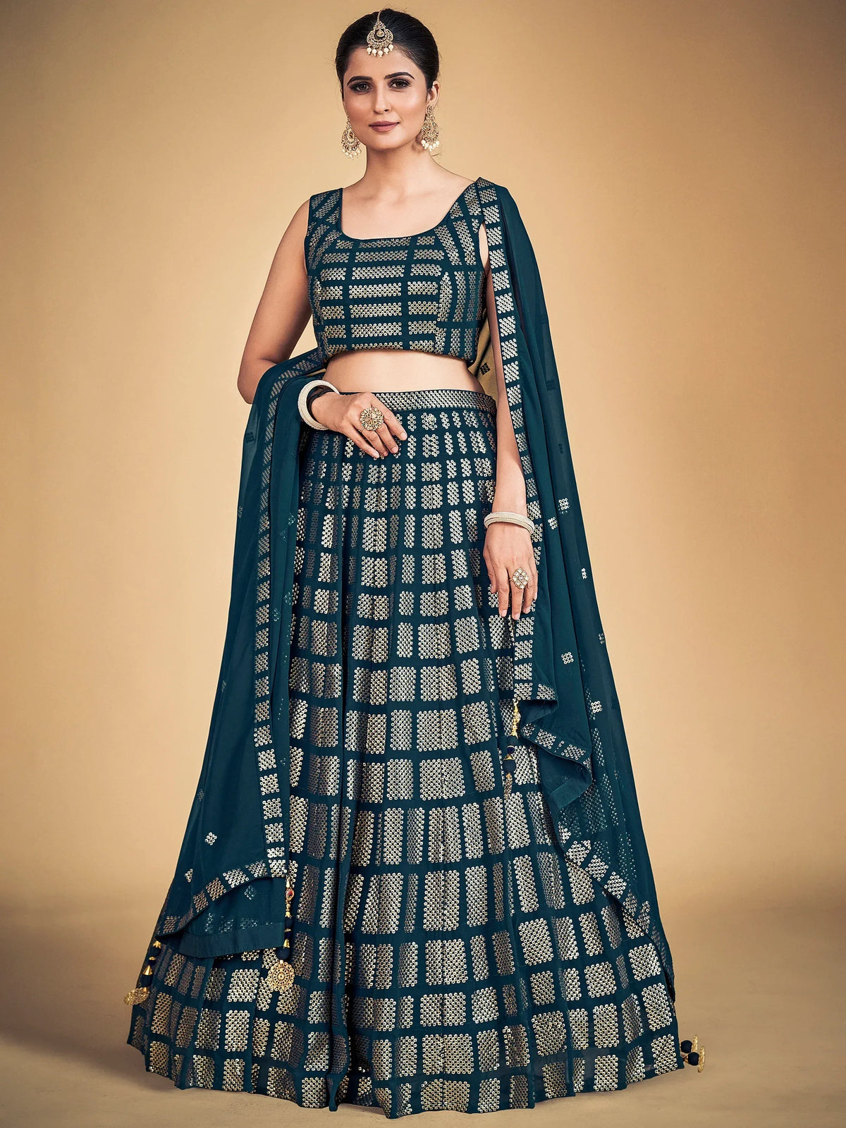 Elegant teal lehenga choli with gold geometric embroidery, perfect for Indian ethnic wear