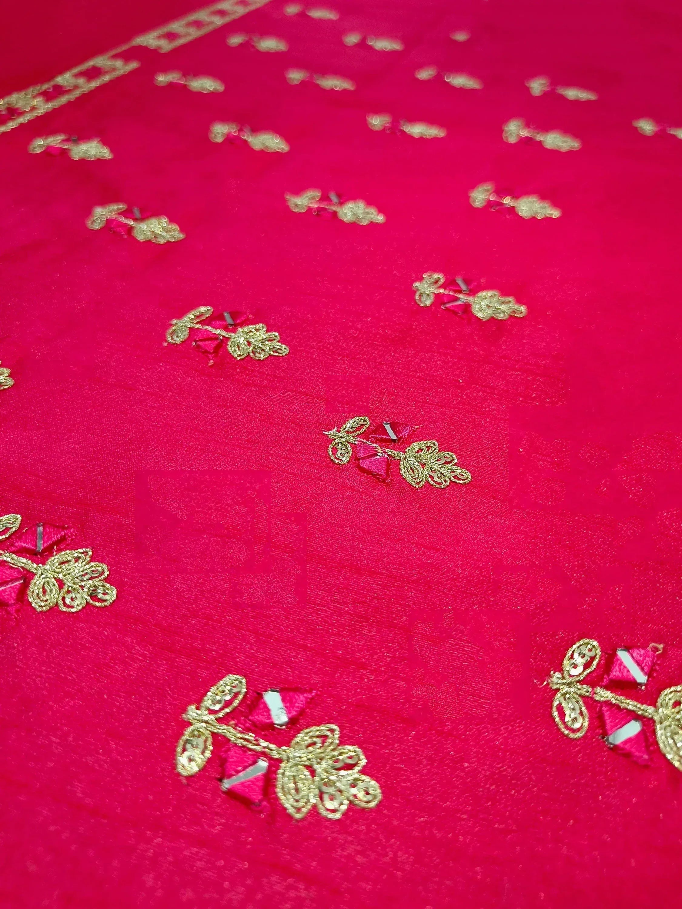 Vibrant pink ethnic wear with gold floral embroidery and mirror work details