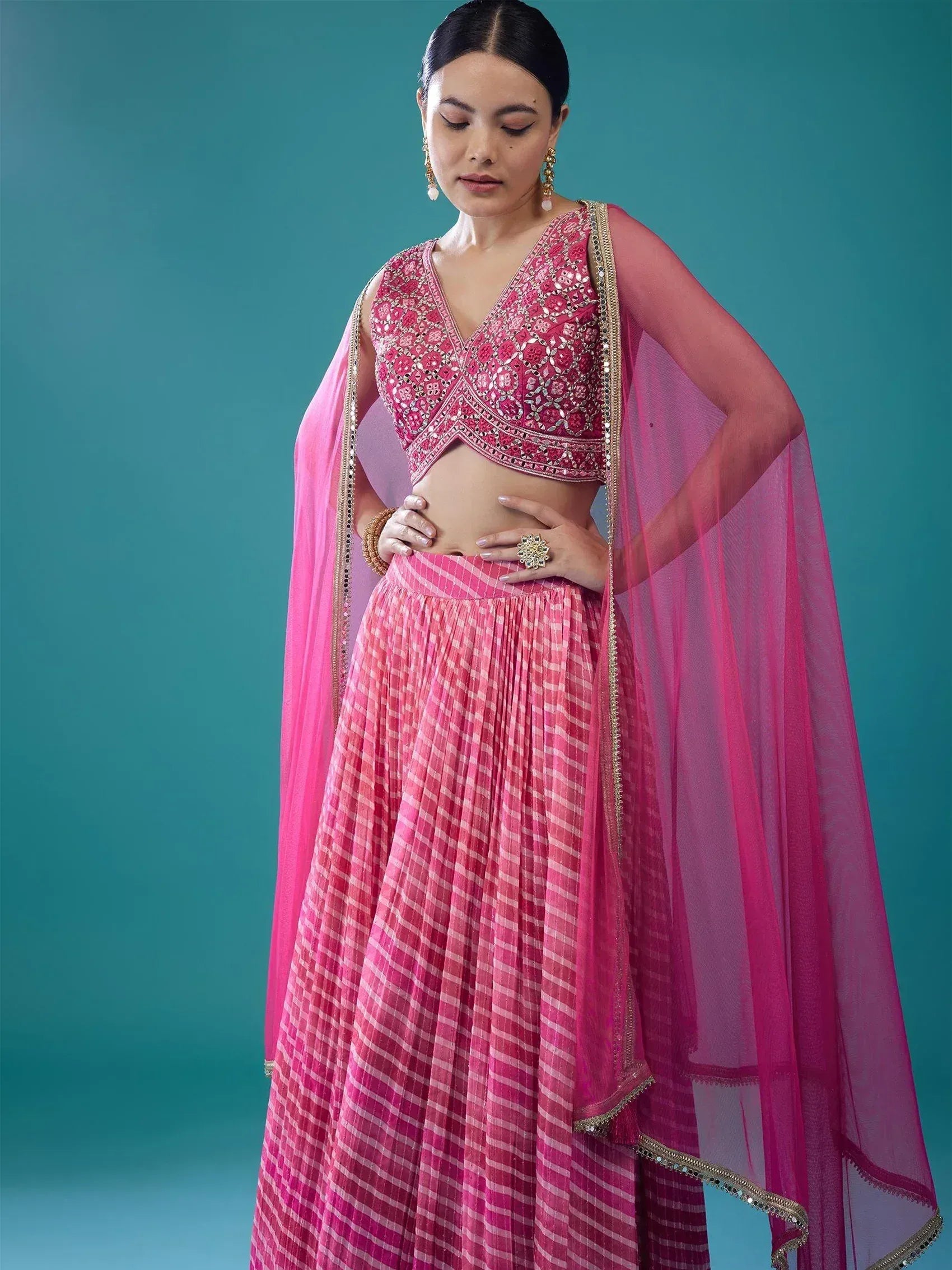 Pink embroidered lehenga choli with sheer dupatta, perfect for Indian ethnic wear occasions