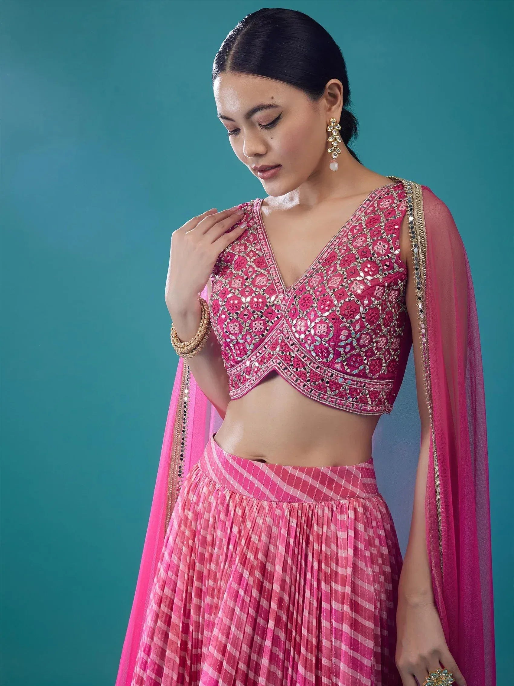 Pink embroidered lehenga choli with mirror work and dupatta, perfect for Indian ethnic wear