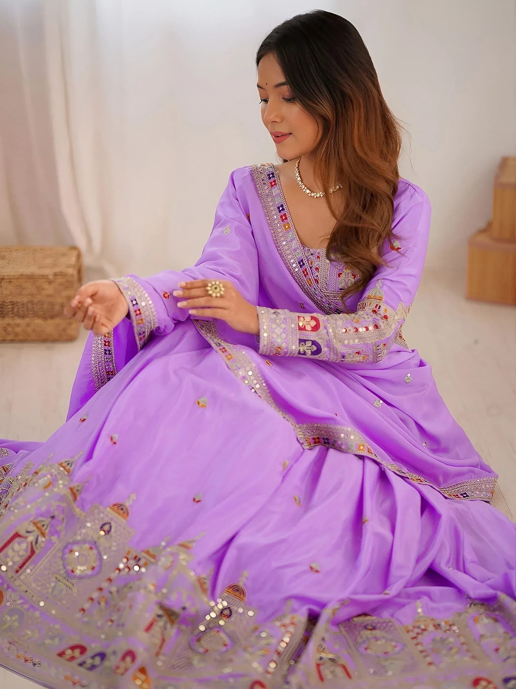 Lavender designer lehenga choli with intricate embroidery and mirror work, perfect for Indian ethnic wear.