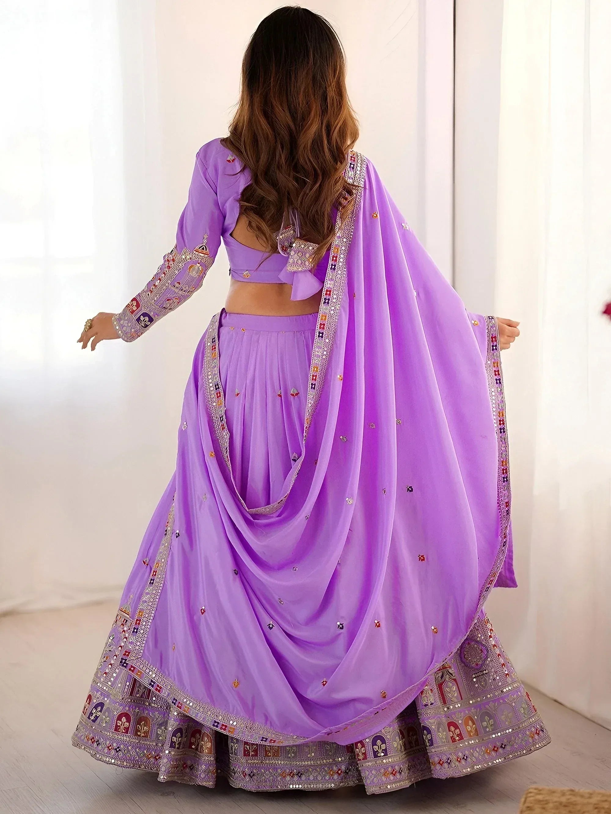 Lavender designer lehenga choli with mirror work and embroidery, perfect for Indian ethnic wear occasions