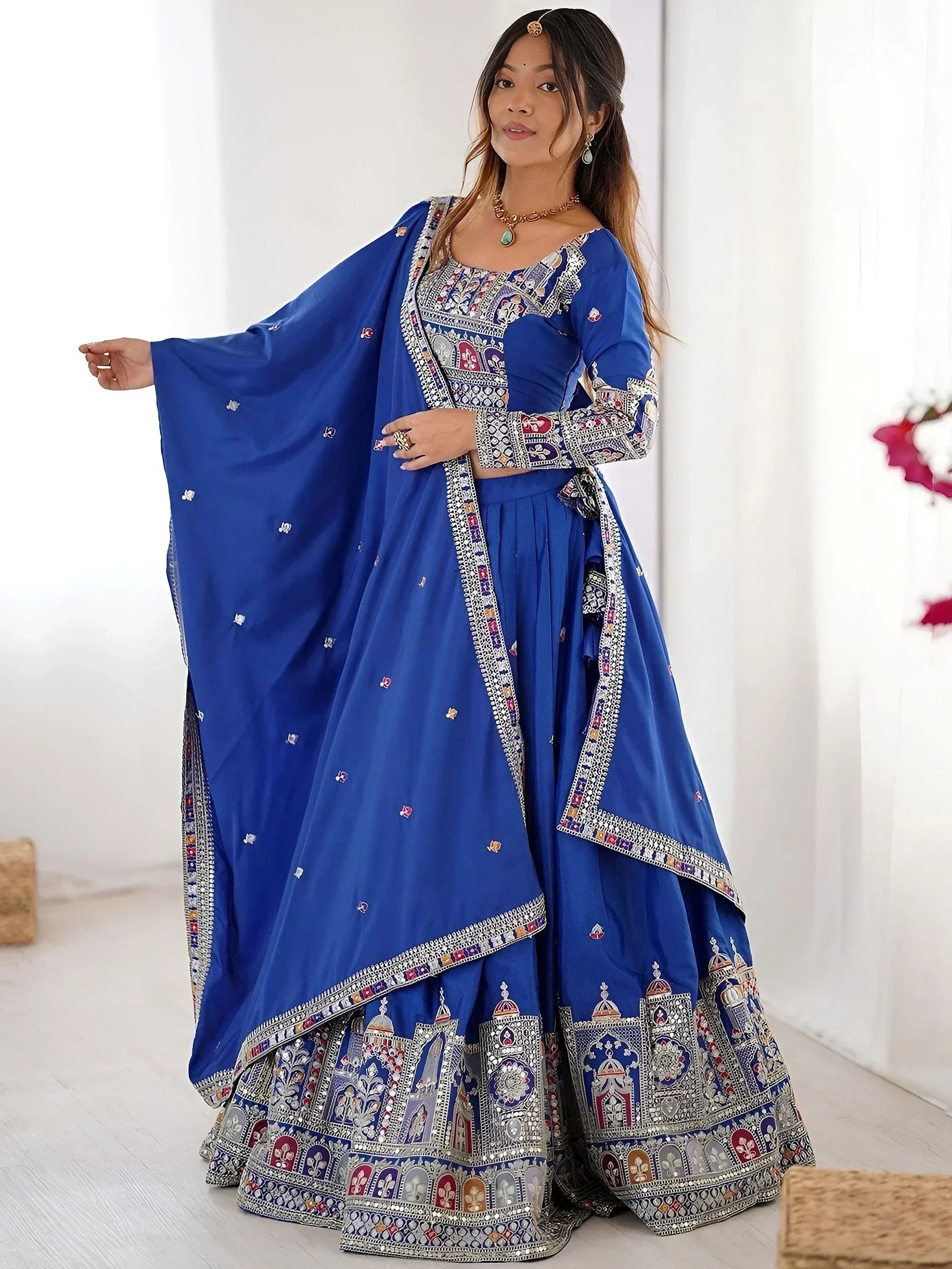 Royal blue embroidered lehenga choli with mirror work and dupatta, perfect for Indian weddings and festivals