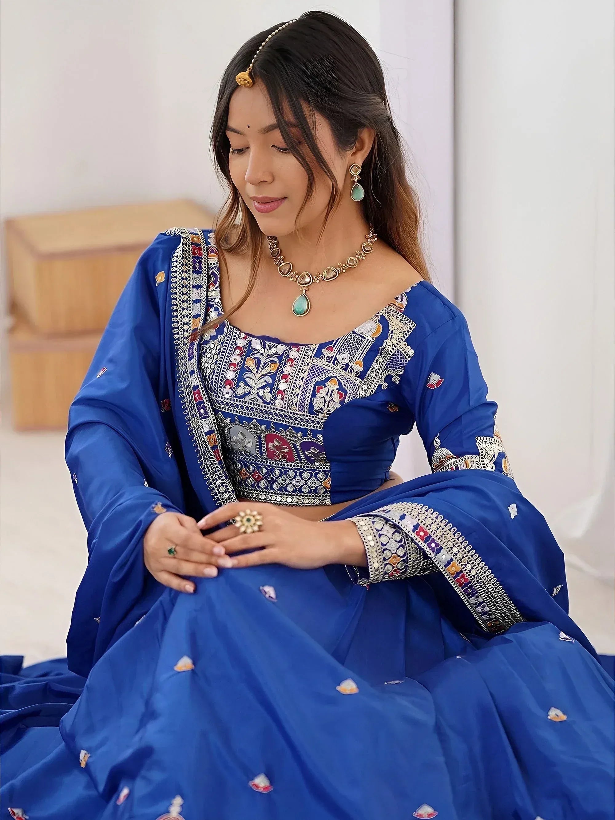 Blue embroidered lehenga choli with mirror work, perfect for Indian ethnic wear and festive occasions.
