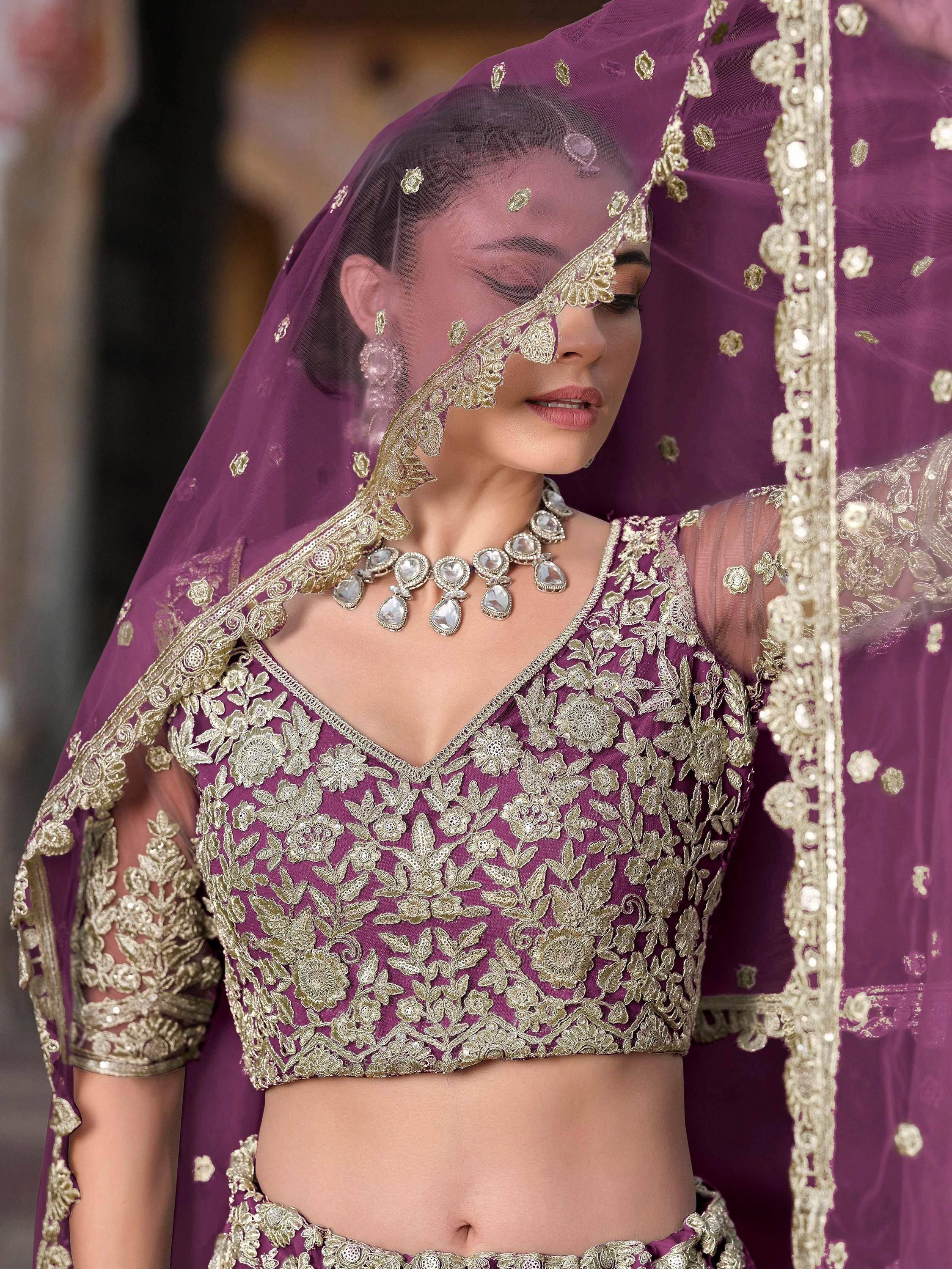 Purple embroidered lehenga choli with gold floral work and matching dupatta for Indian ethnic wear