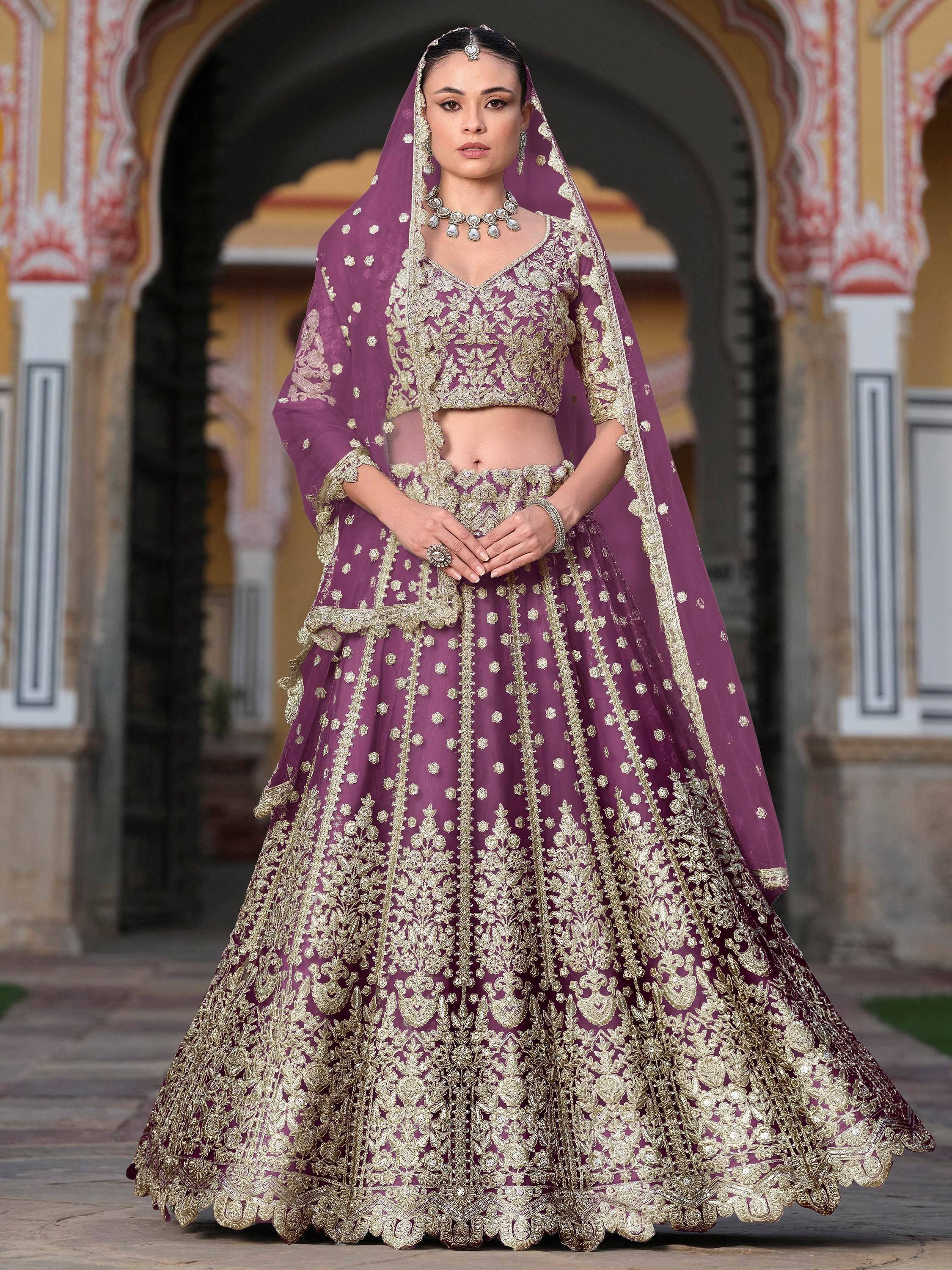 Purple and gold embroidered lehenga choli with dupatta, traditional Indian ethnic wear for weddings