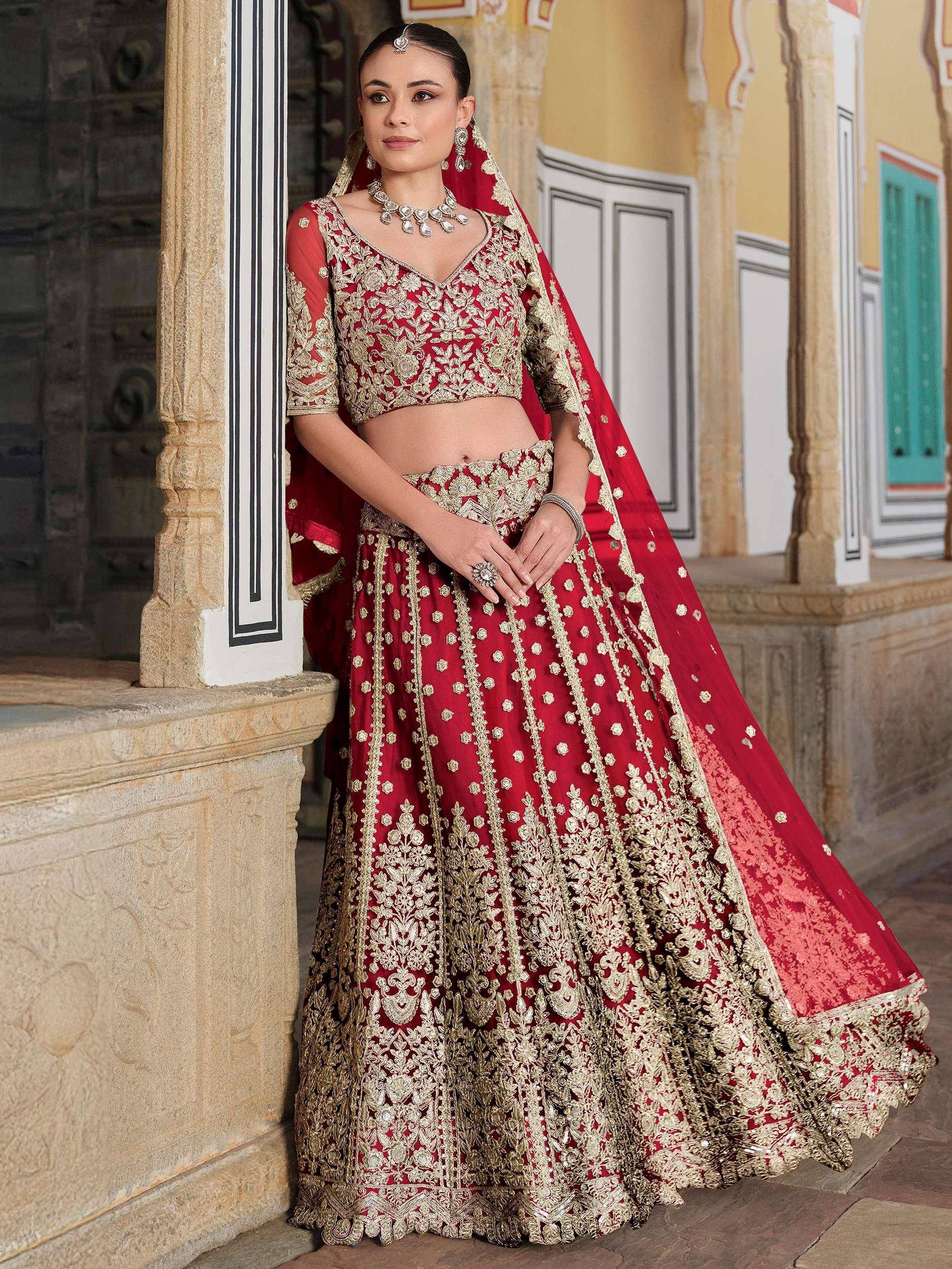 Red and gold embroidered lehenga choli with dupatta, Indian ethnic wear for weddings