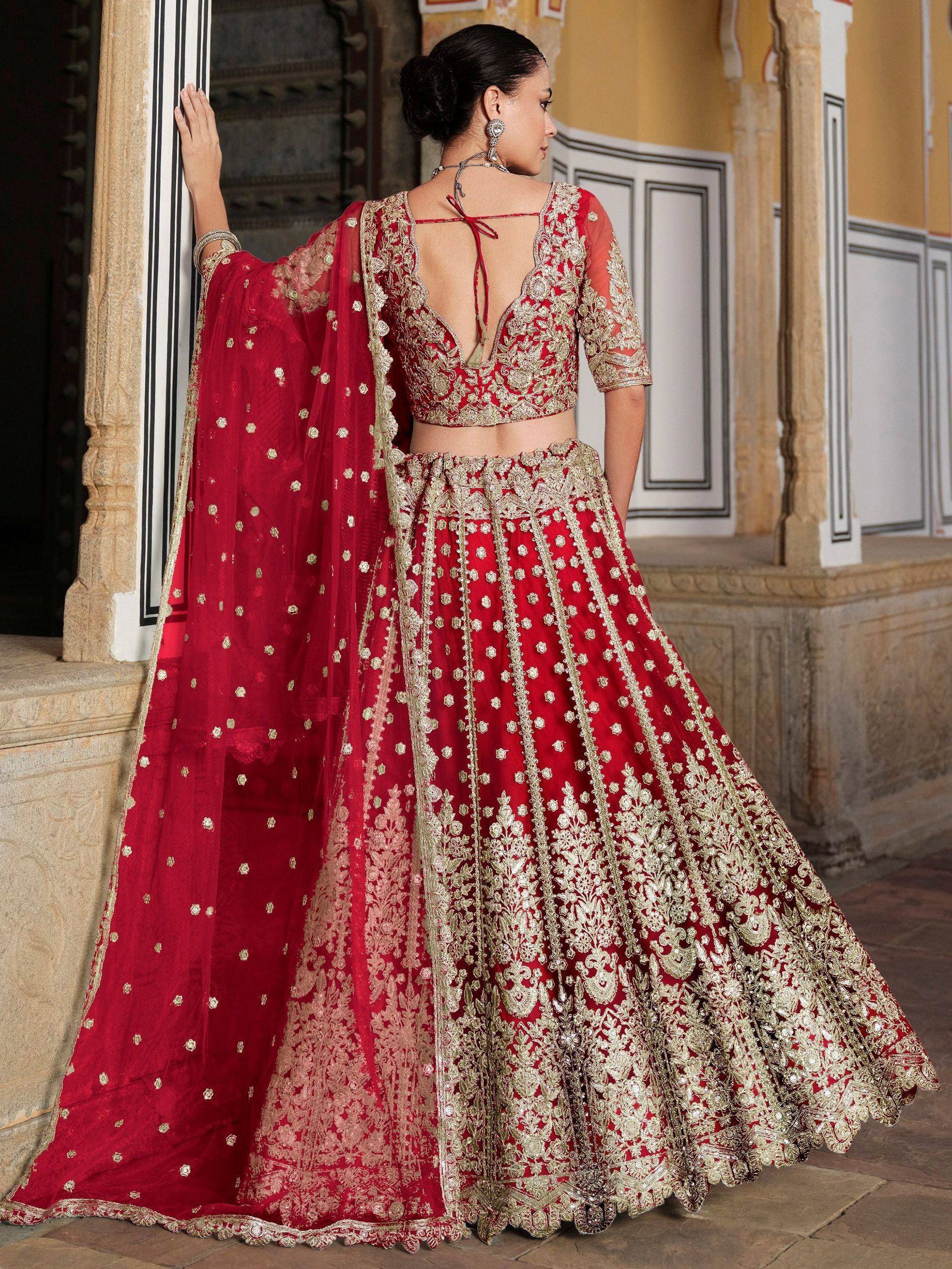 Red and gold embroidered lehenga choli with sheer dupatta, Indian ethnic wear for weddings