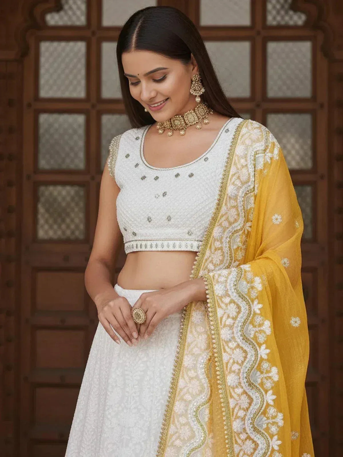White embroidered lehenga choli with yellow dupatta, perfect for Indian ethnic wear occasions