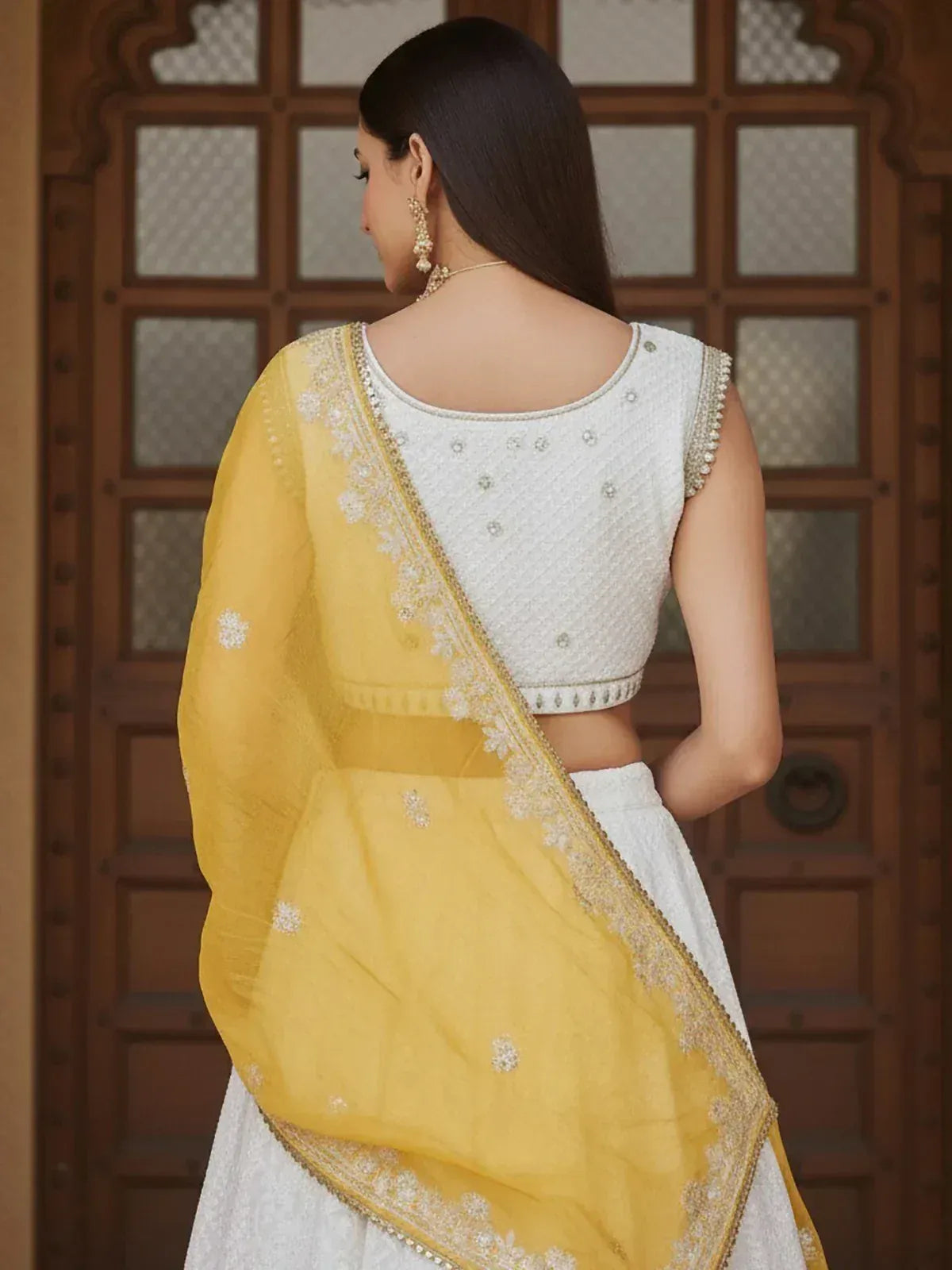 White embroidered lehenga choli with yellow dupatta, ethnic Indian wear for women