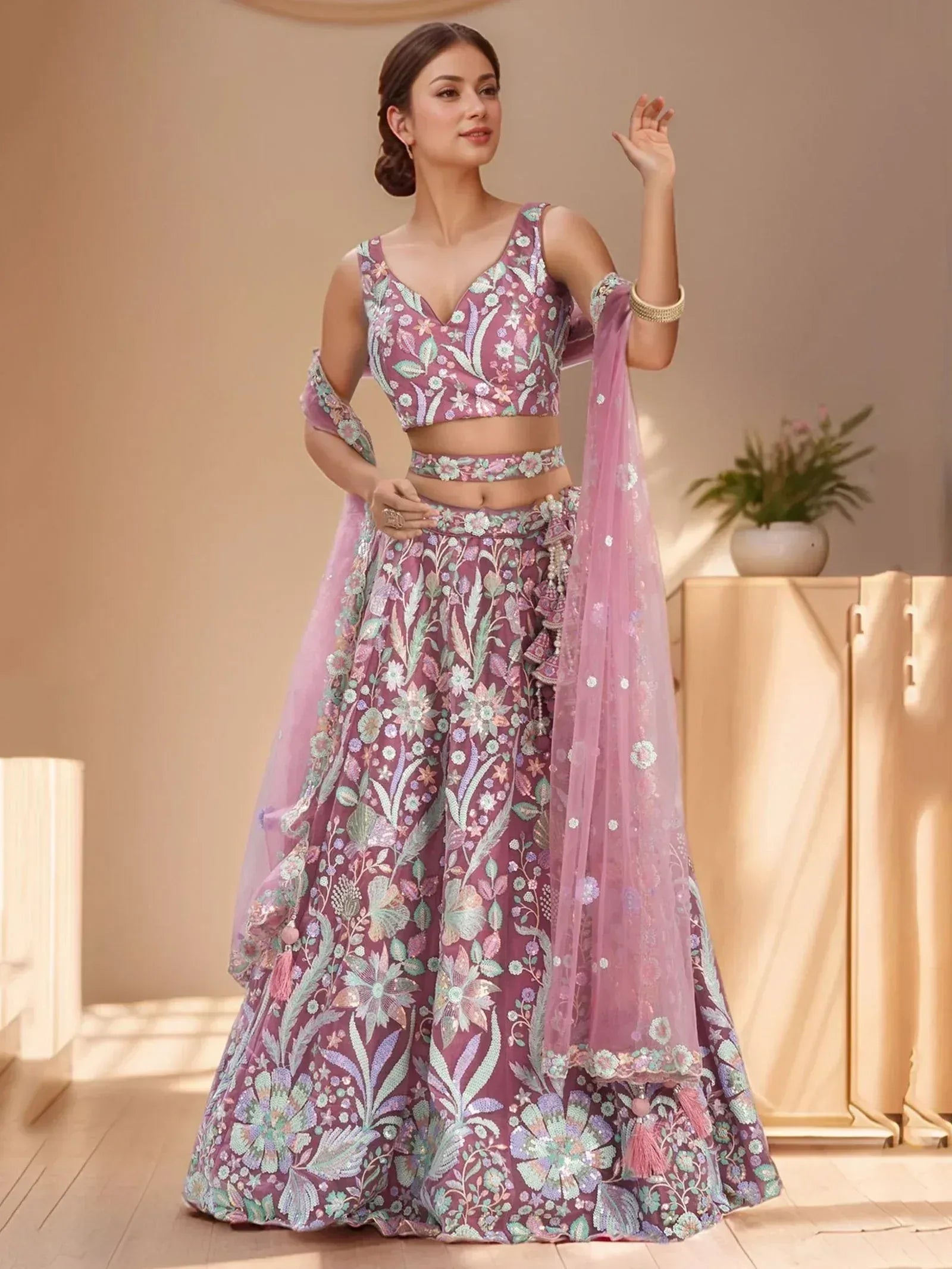 Elegant purple floral lehenga choli with embroidered blouse and dupatta, perfect for Indian ethnic wear occasions.