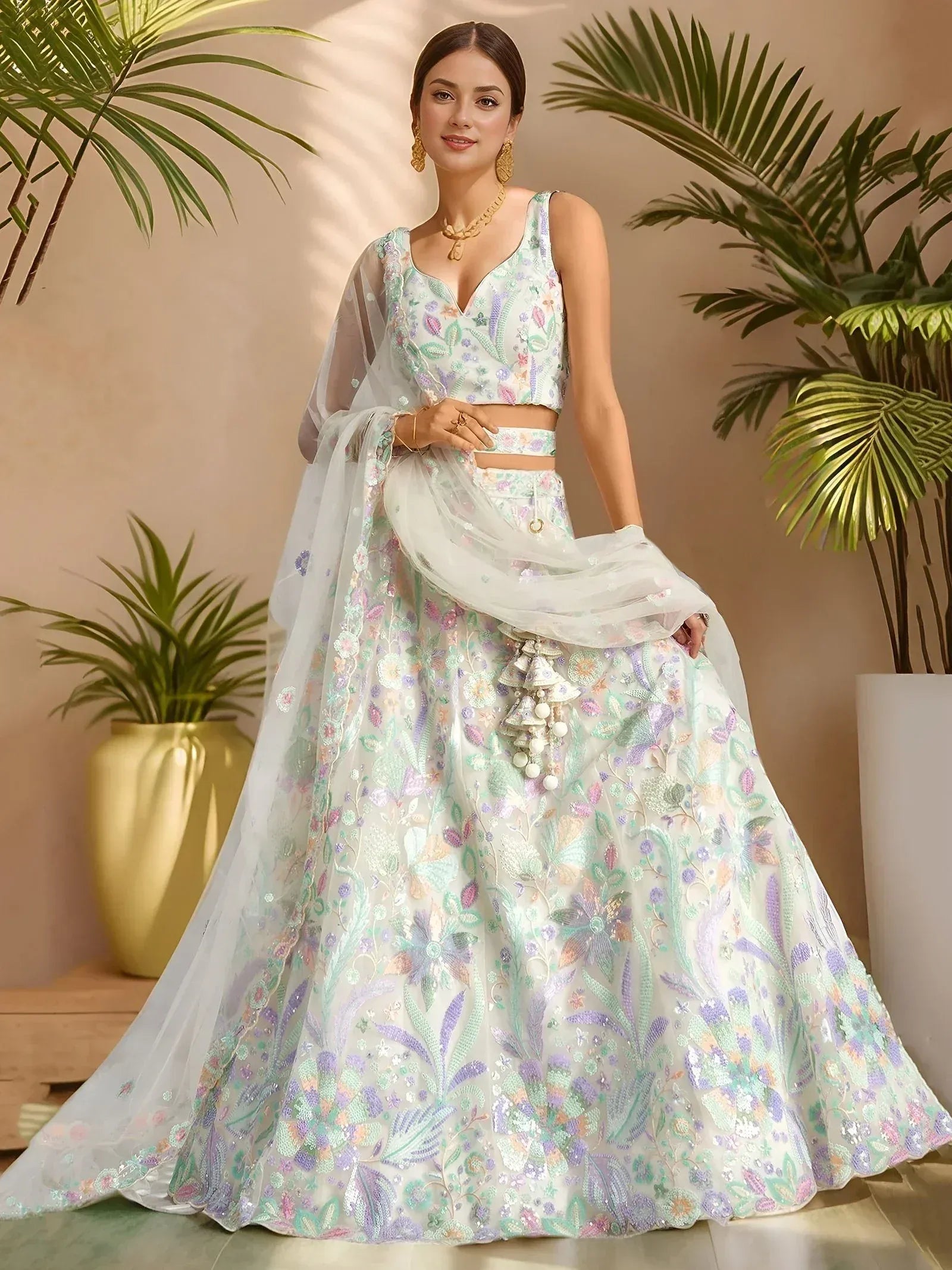 Elegant floral embroidered lehenga choli with pastel hues and sheer dupatta for Indian ethnic wear