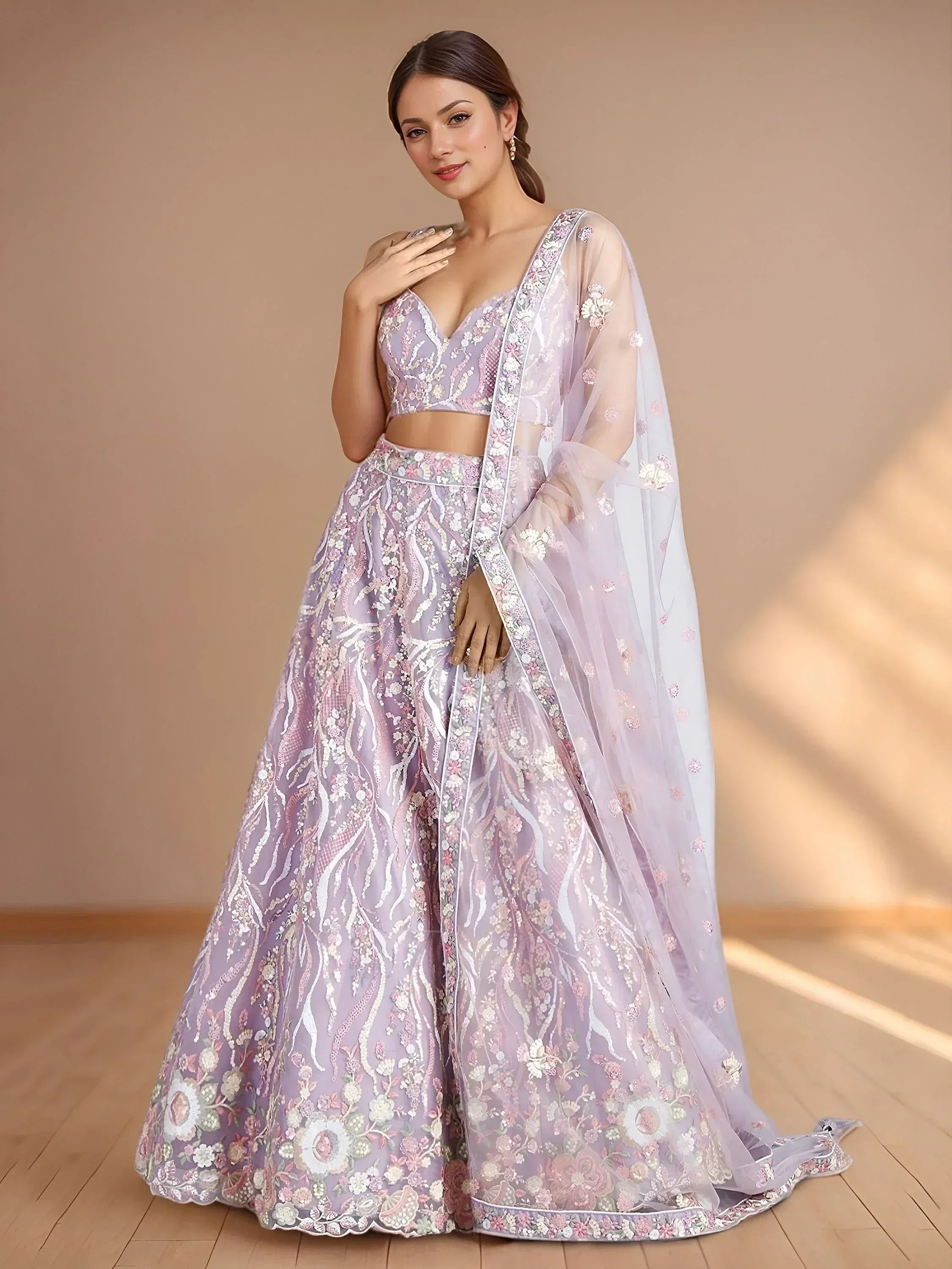 Lavender designer lehenga choli with floral embroidery and sheer dupatta, perfect for Indian ethnic wear.