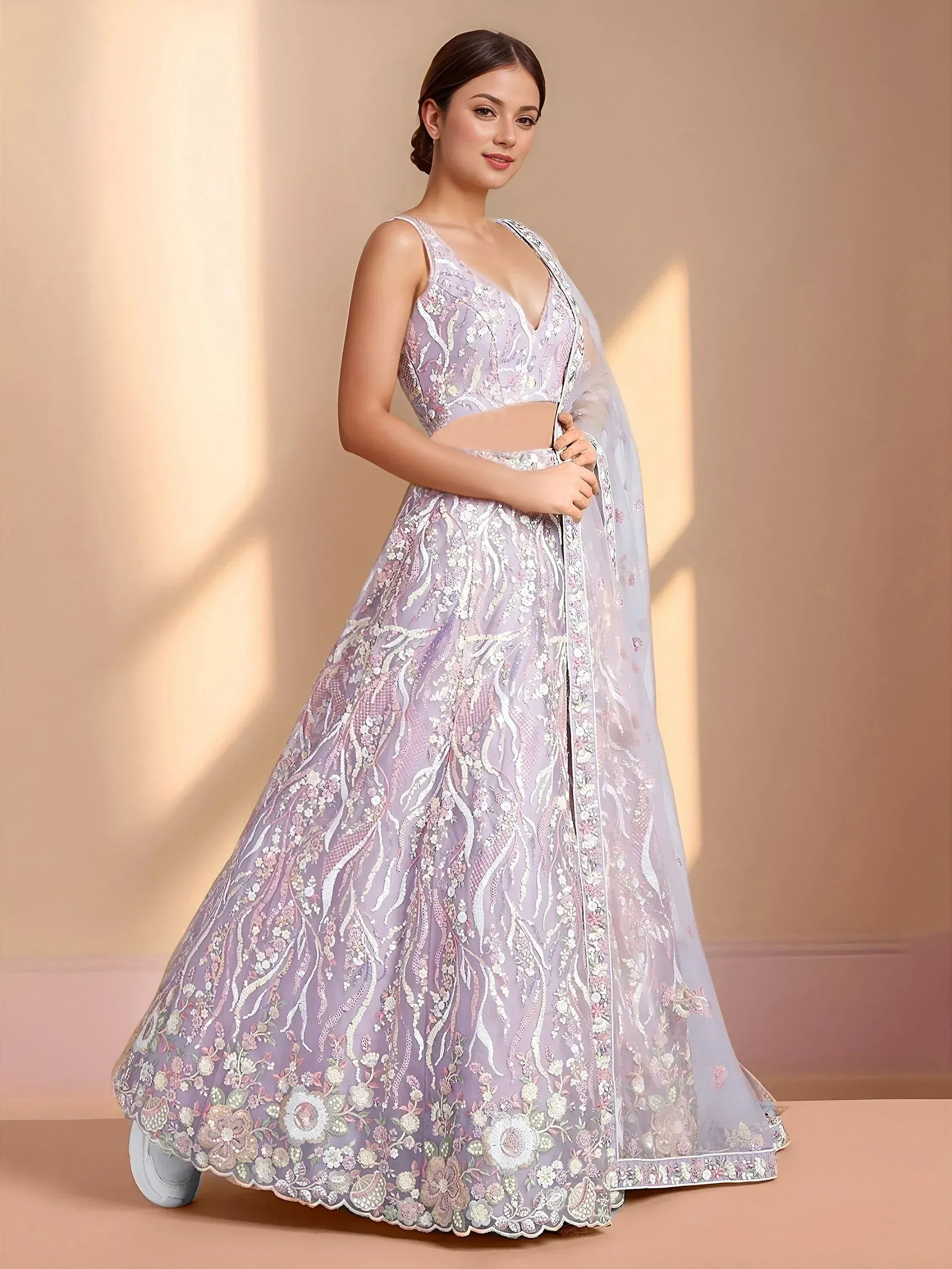 Lavender designer lehenga choli with floral embroidery and sheer dupatta, perfect for Indian ethnic occasions