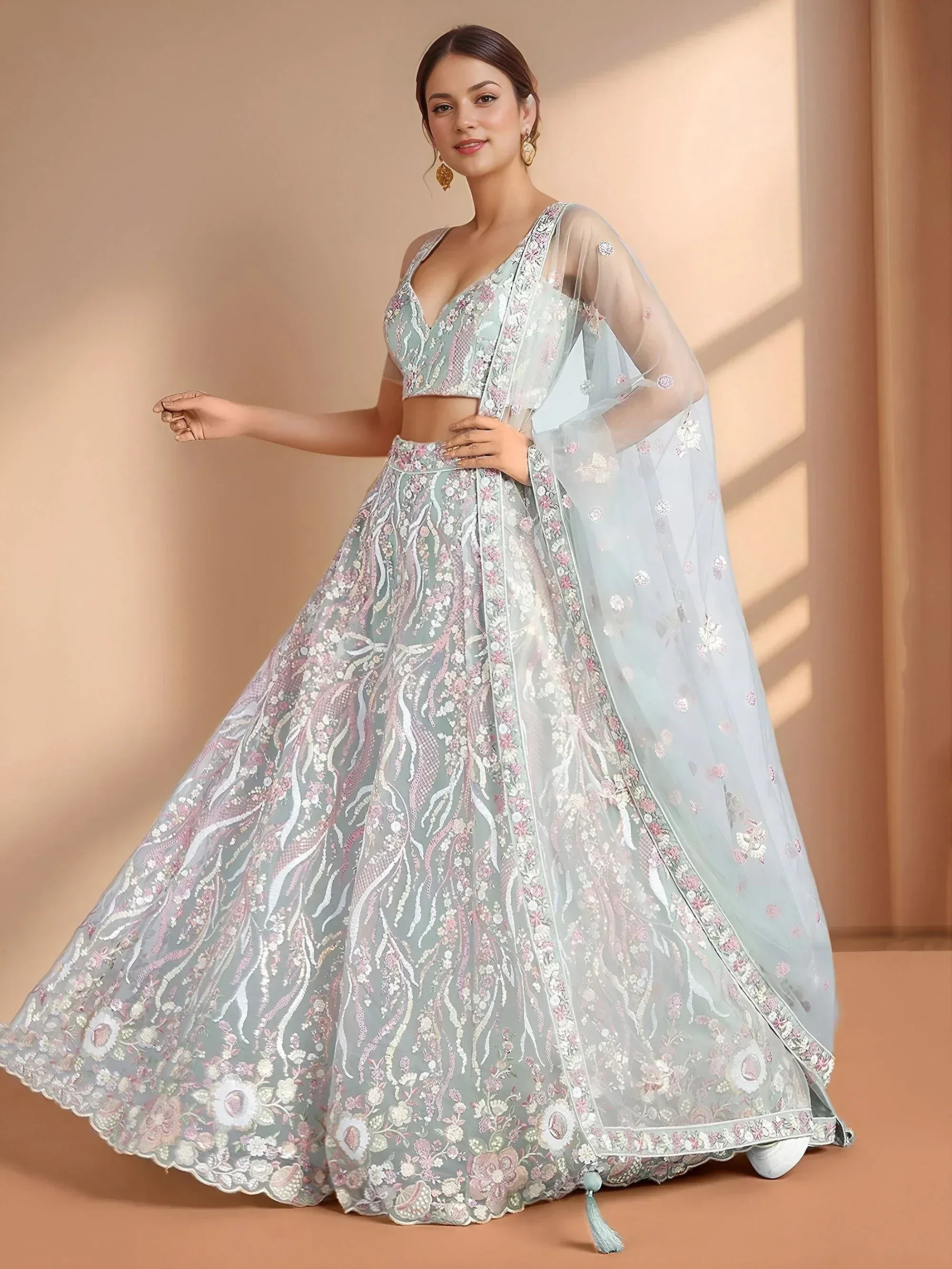 Elegant light blue lehenga choli with floral embroidery and sheer dupatta for Indian ethnic wear