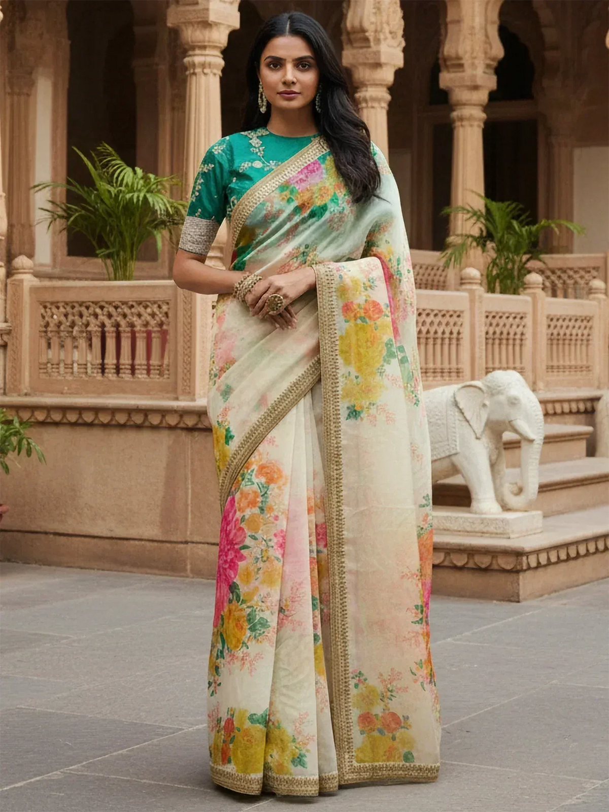 Floral print saree with gold border, paired with green blouse, perfect for Indian ethnic occasions